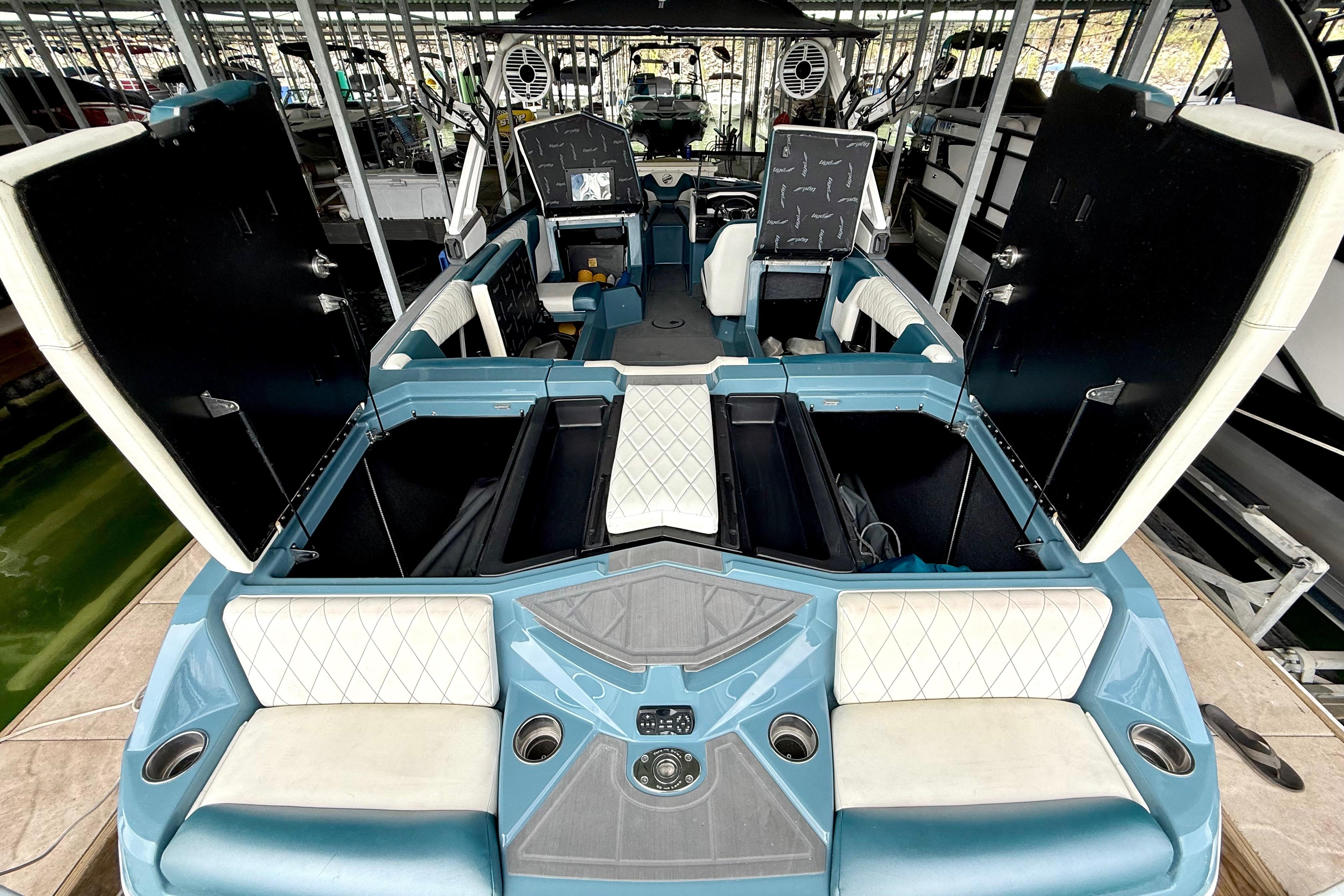 2021 Tige Z3 boat interior with open storage compartments and seating.