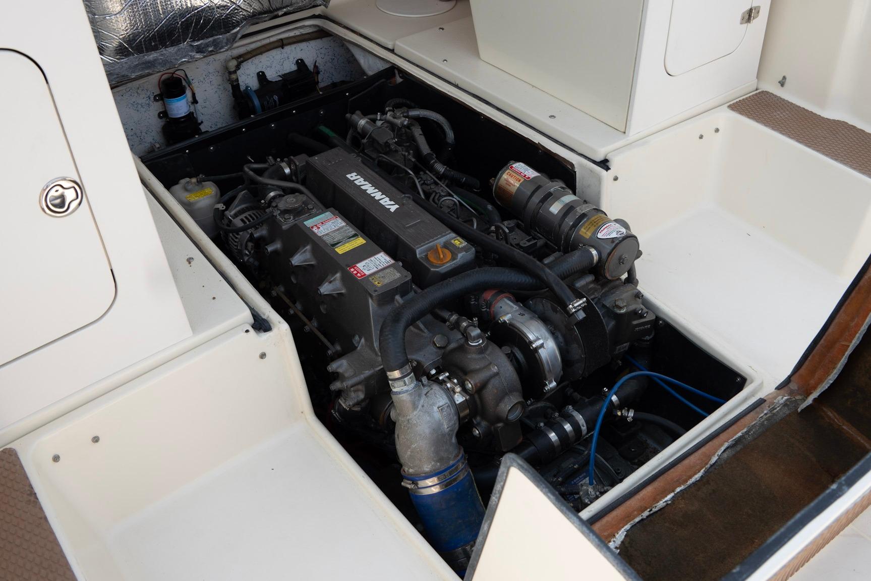 Engine compartment of a 2006 Atlas Boat Works Acadia 25, featuring a Yanmar engine.