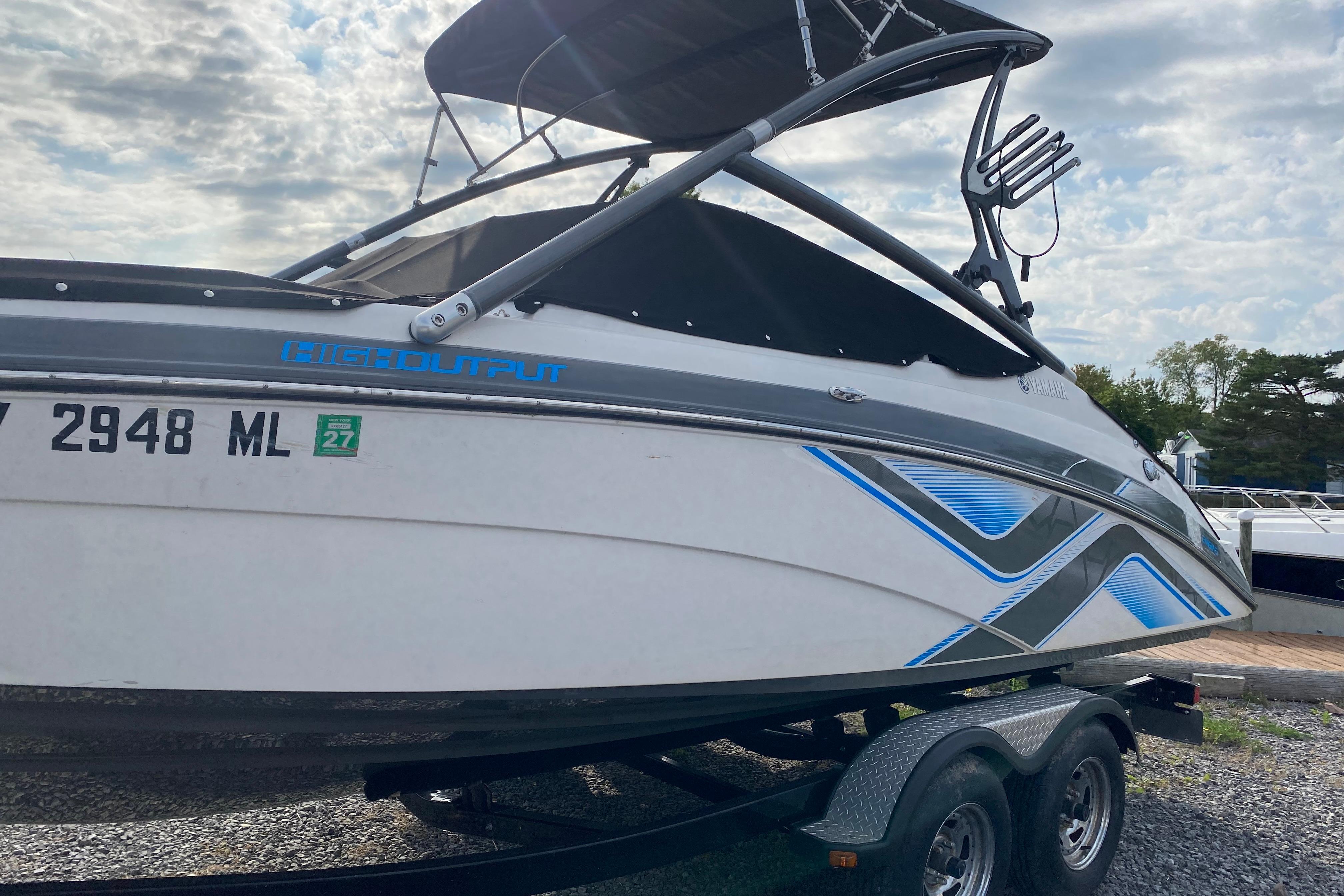 2015 Yamaha Boats 212X on trailer, featuring sleek design and high output graphics.