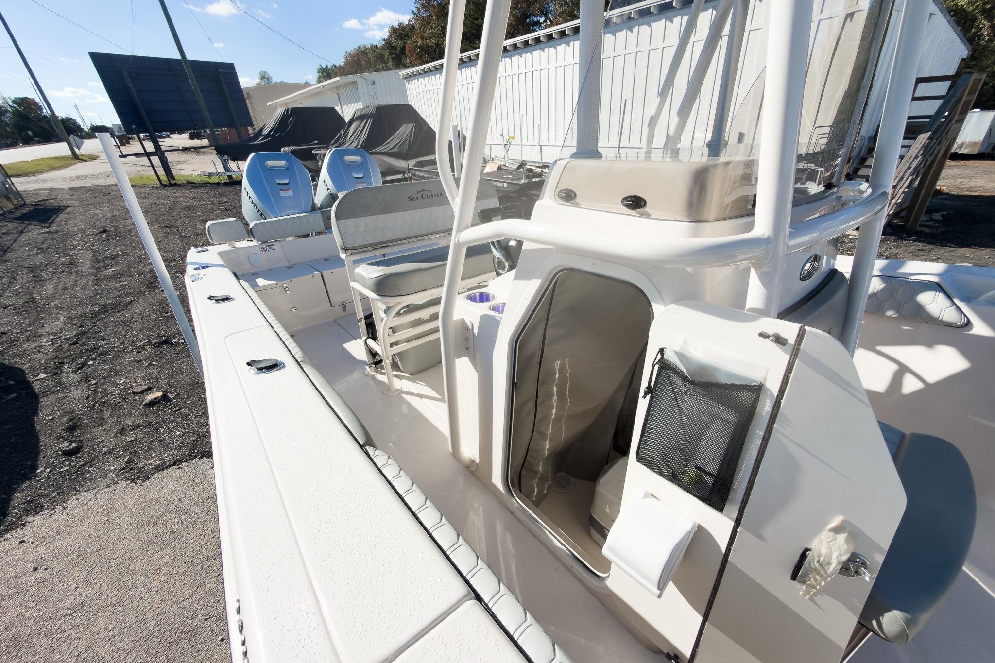 2026 Sea Chaser 24 HFC DE boat interior with seating and storage compartments.