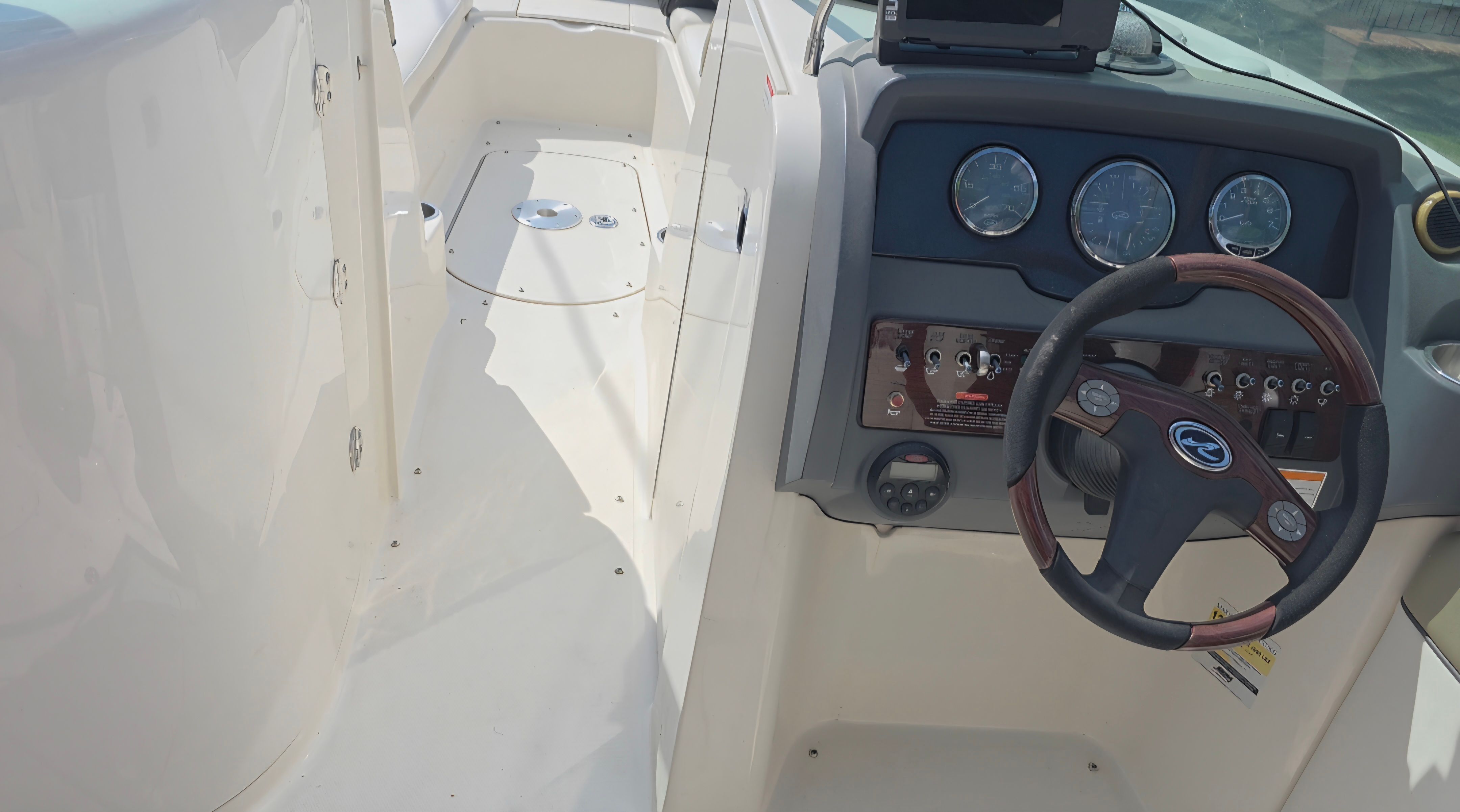 Interior view of a 2007 Sea Ray 260 Sundeck boat with helm console.