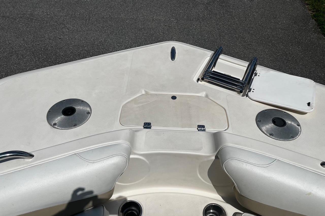 2008 Hurricane FD202 boat deck with seating, ladder, and storage compartments.