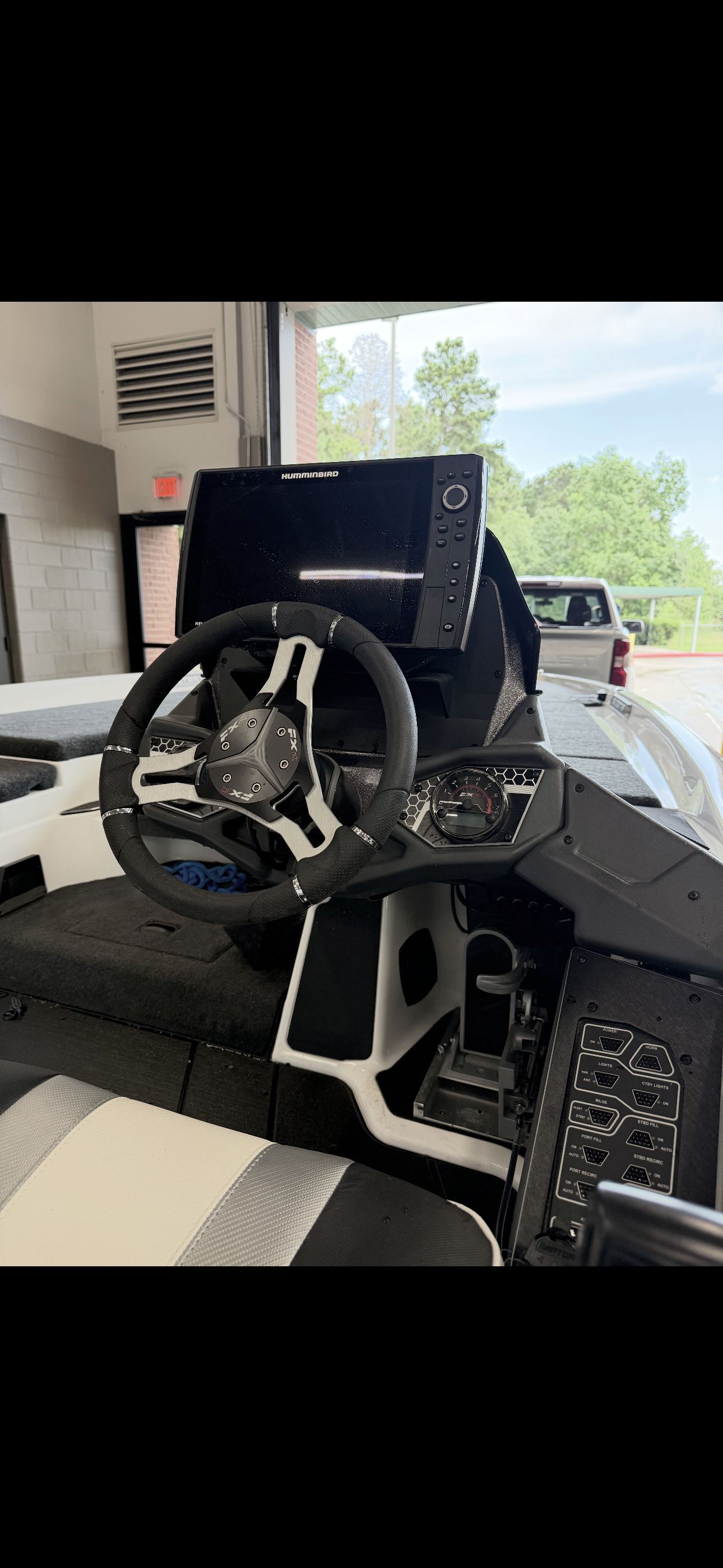 The image shows the cockpit of a 2022 Skeeter FXR20 Limited boat with a modern helm.
