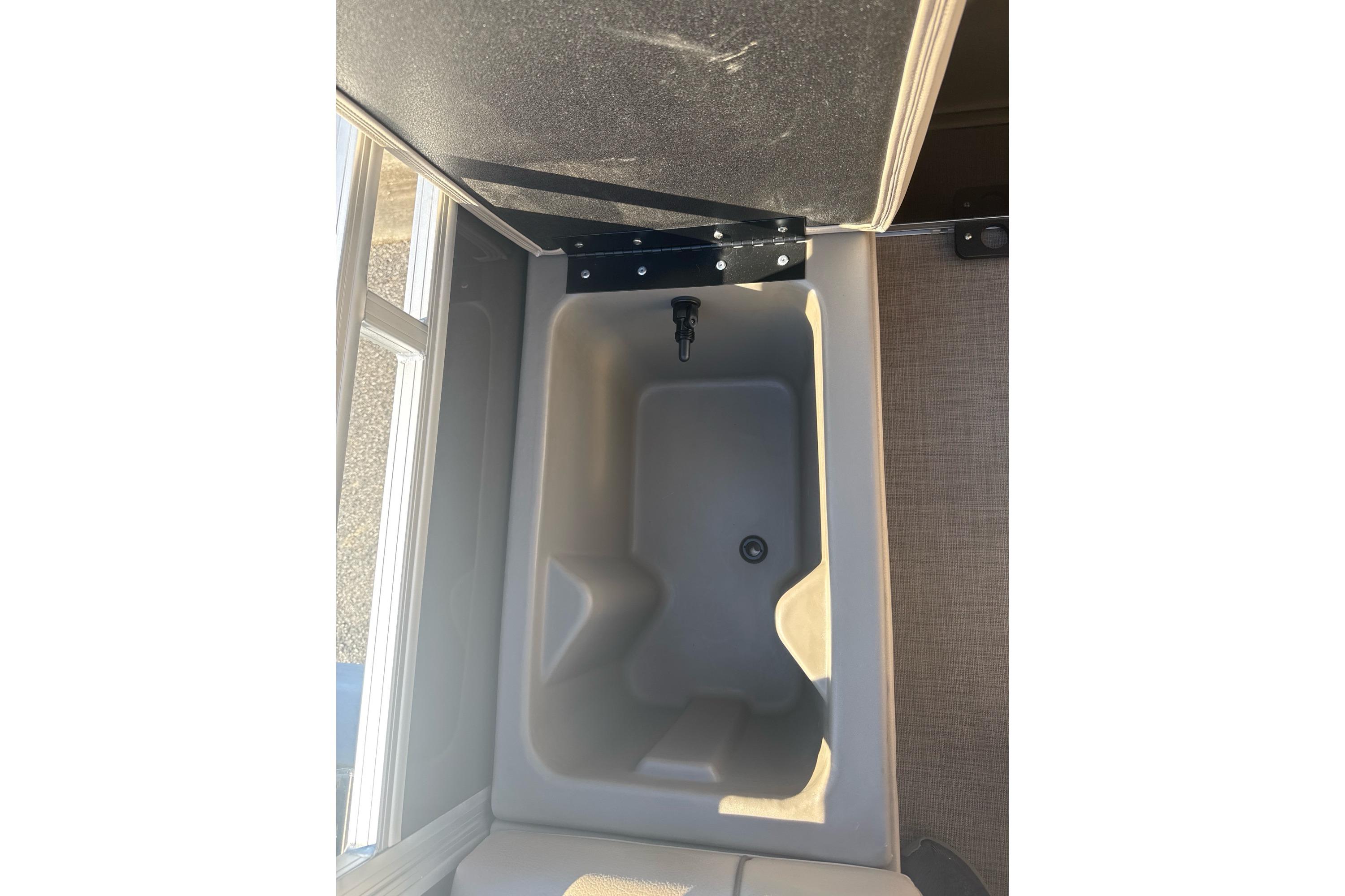 2025 Sun Tracker SportFish 22 DLX boat interior storage compartment.