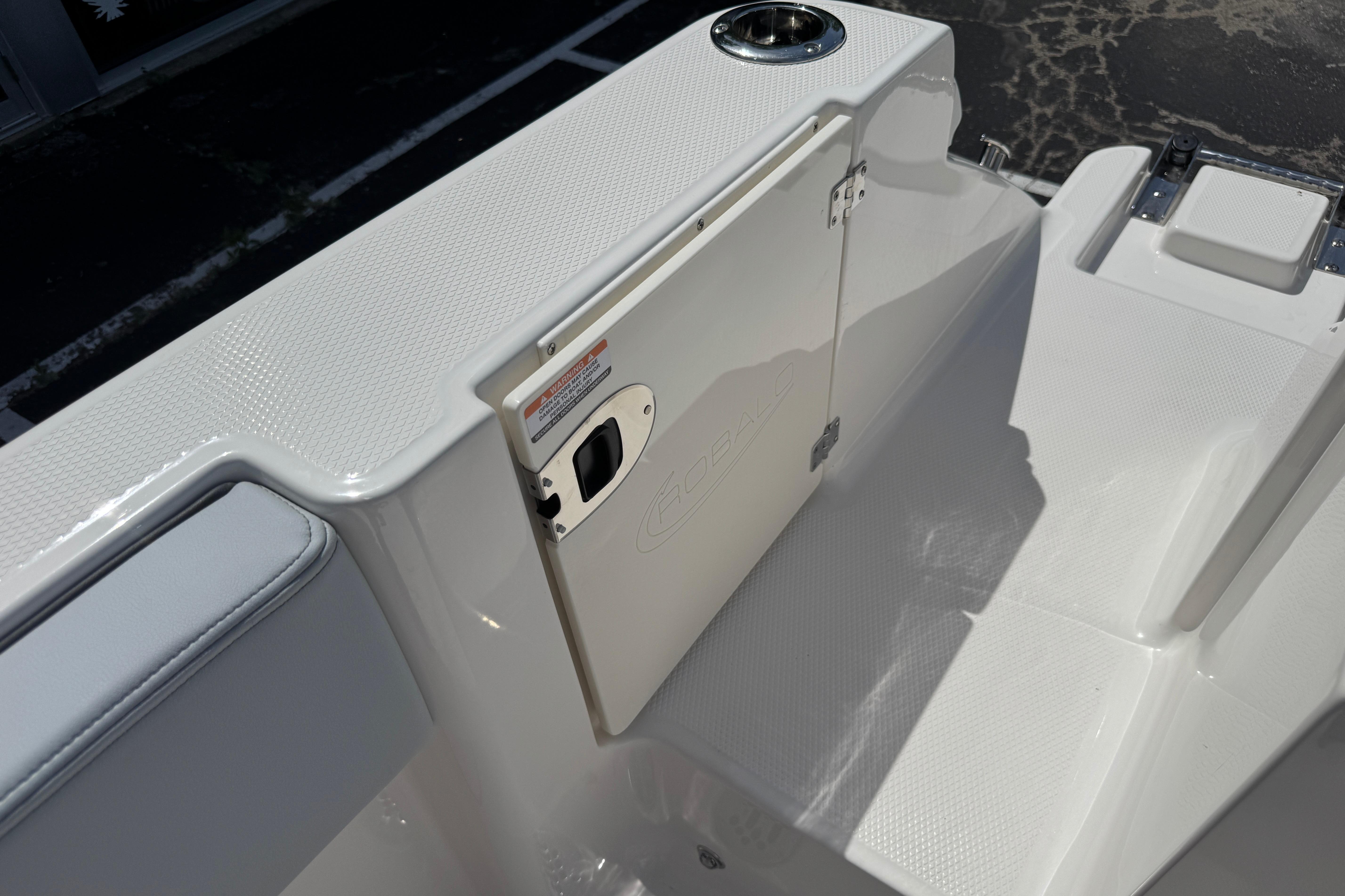 2026 Robalo R250 Center Console boat interior with textured surfaces and storage compartment.