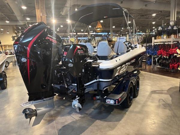 2023 Nitro ZV20 Pro boat displayed indoors with dual engines and canopy.