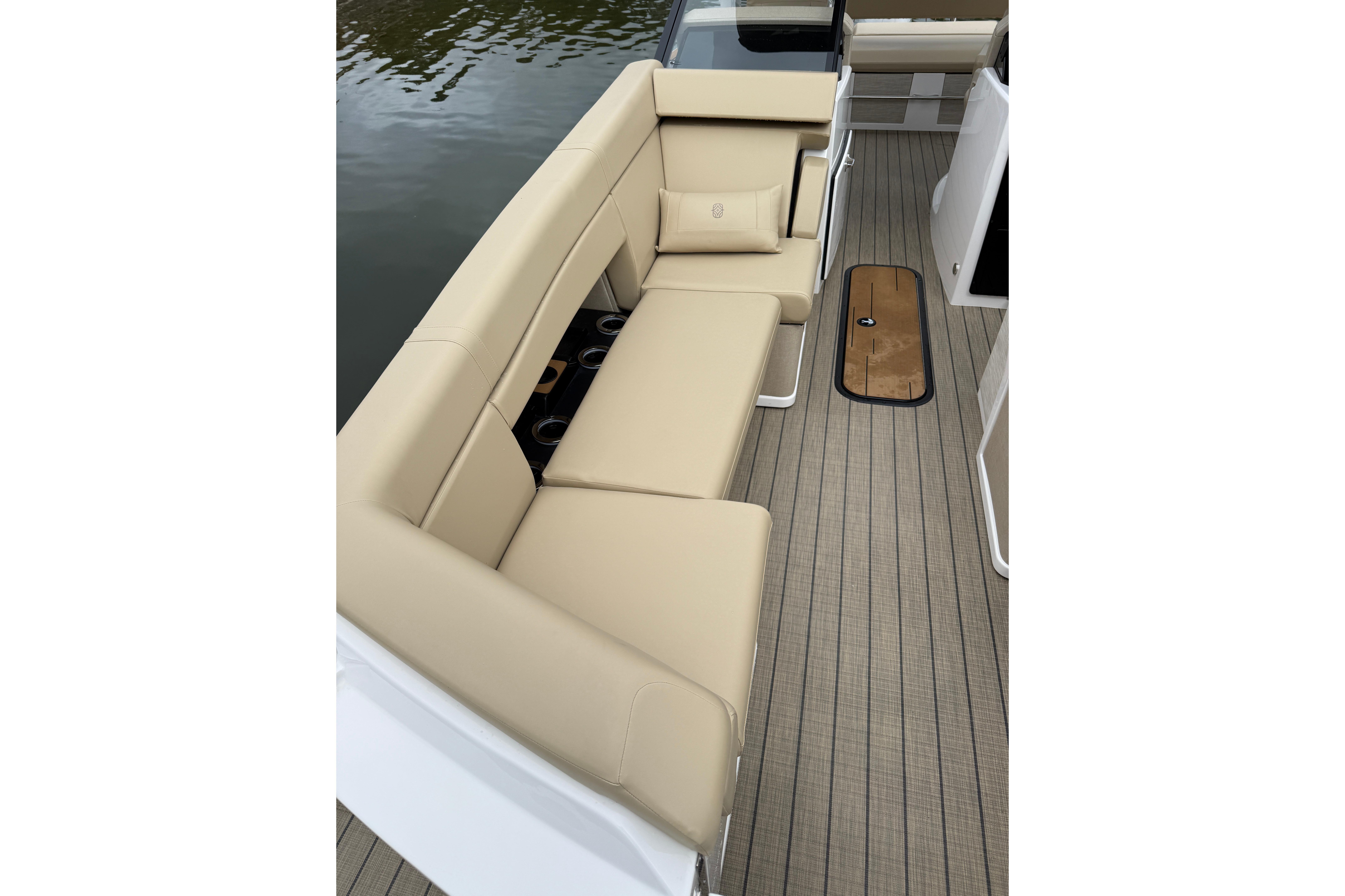 Luxurious seating on the 2025 Balise Helix 26 L boat, featuring beige upholstery and sleek design.