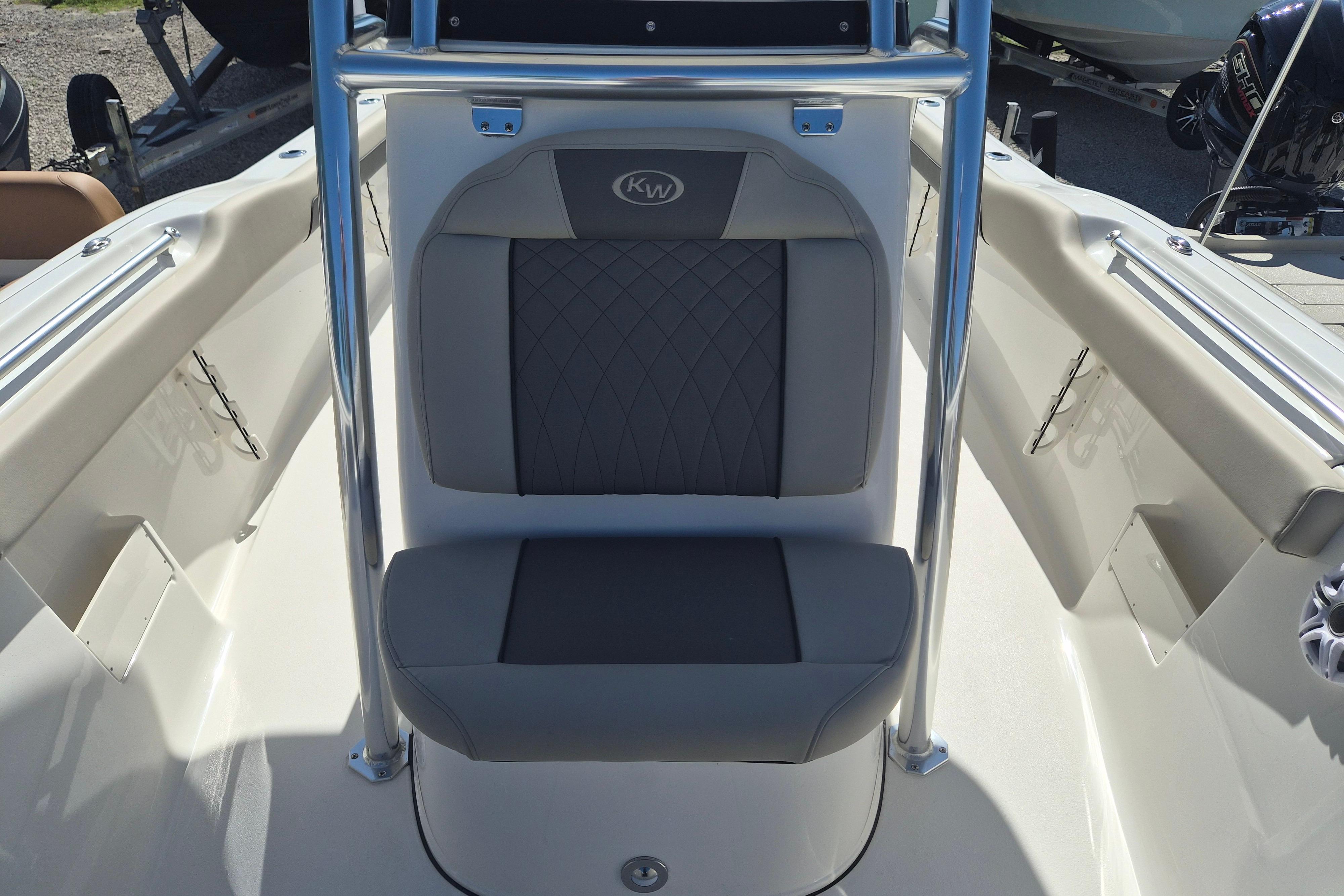 2026 Key West 239 FS boat seating area with gray cushioned seats and stainless steel frame.