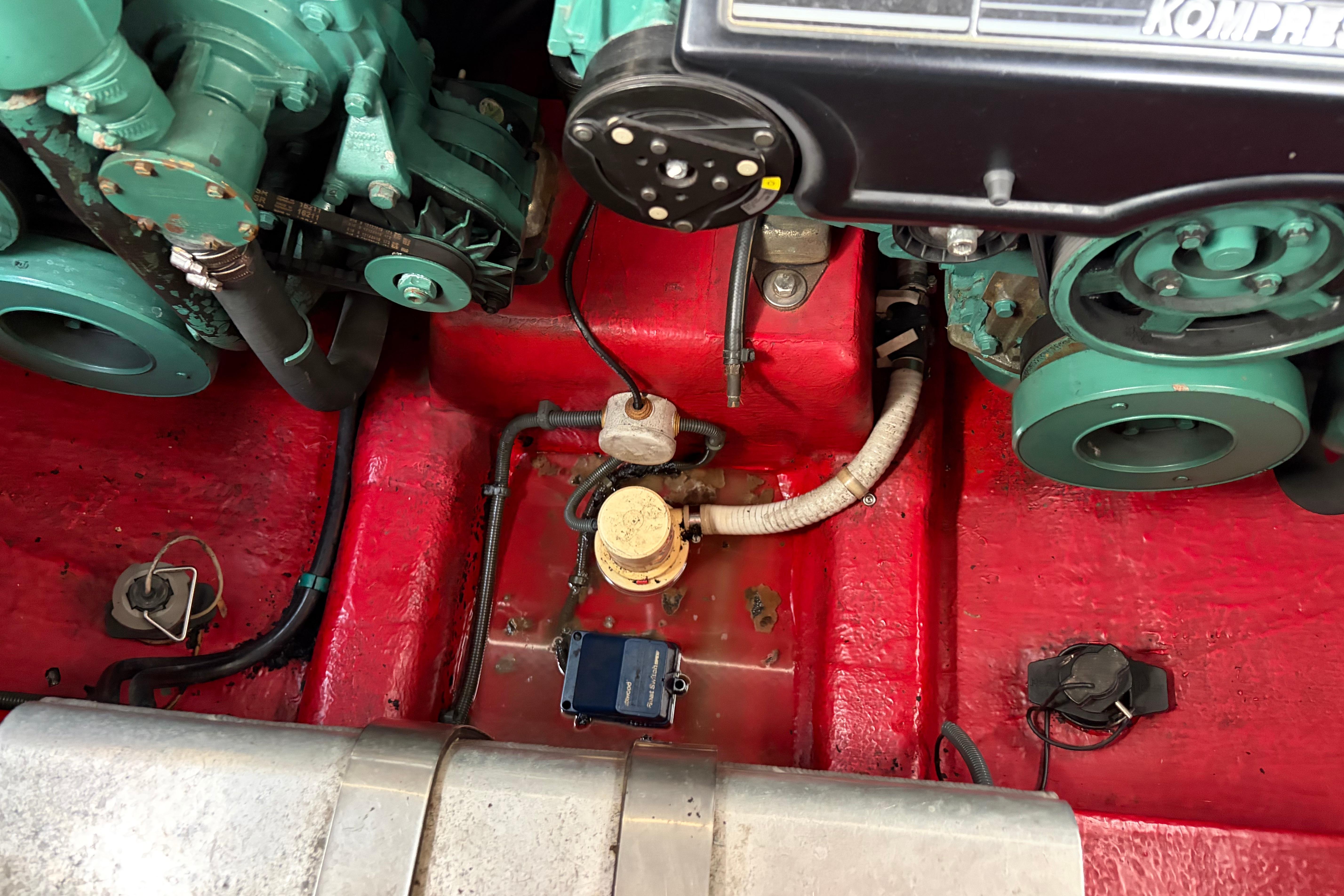 Engine compartment of a 2000 Sunseeker Superhawk 34, showcasing mechanical components and wiring.