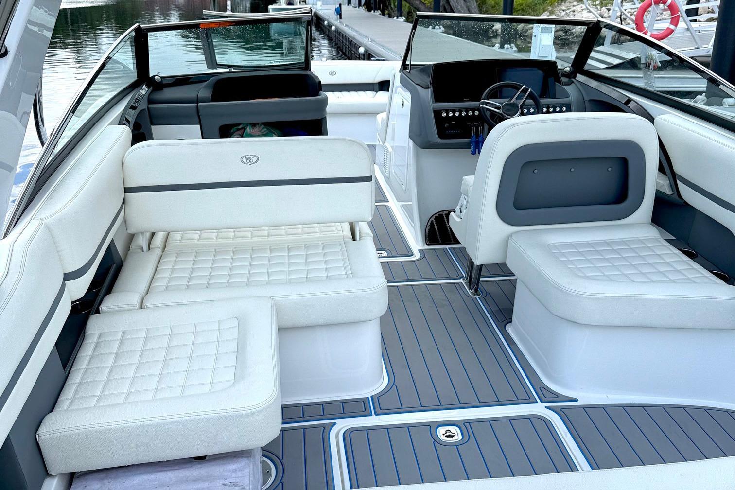 2022 Cobalt R30 boat interior with white seating and modern dashboard design.