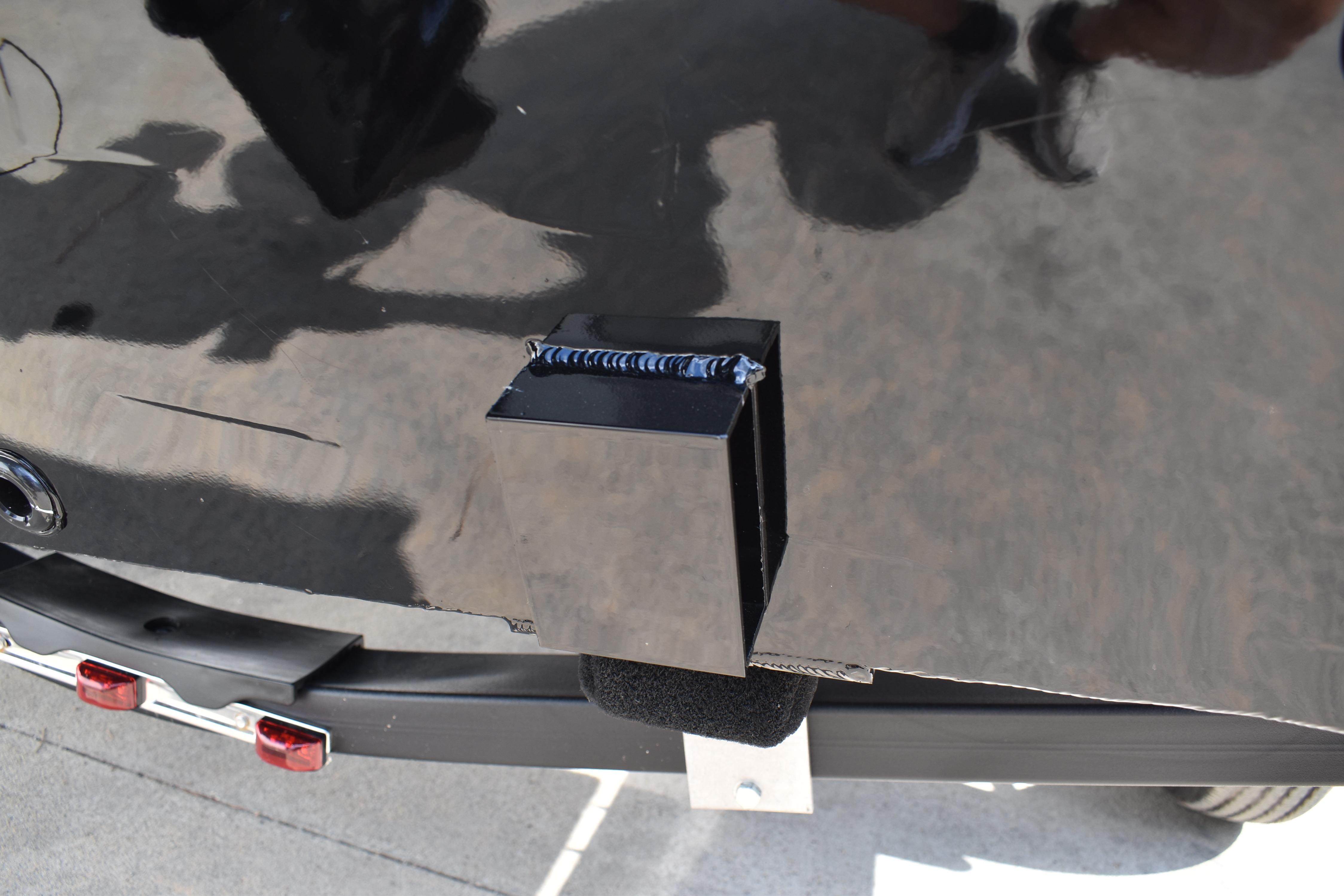 Close-up of Lowe Skorpion 17 boat detail, 2026 model, showing a black metal component.