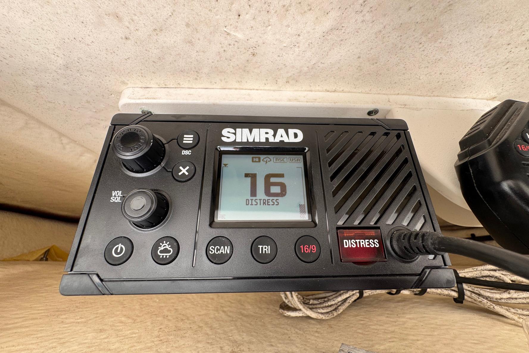 Simrad marine radio on 2021 Robalo 246 Cayman, displaying channel 16 distress signal.