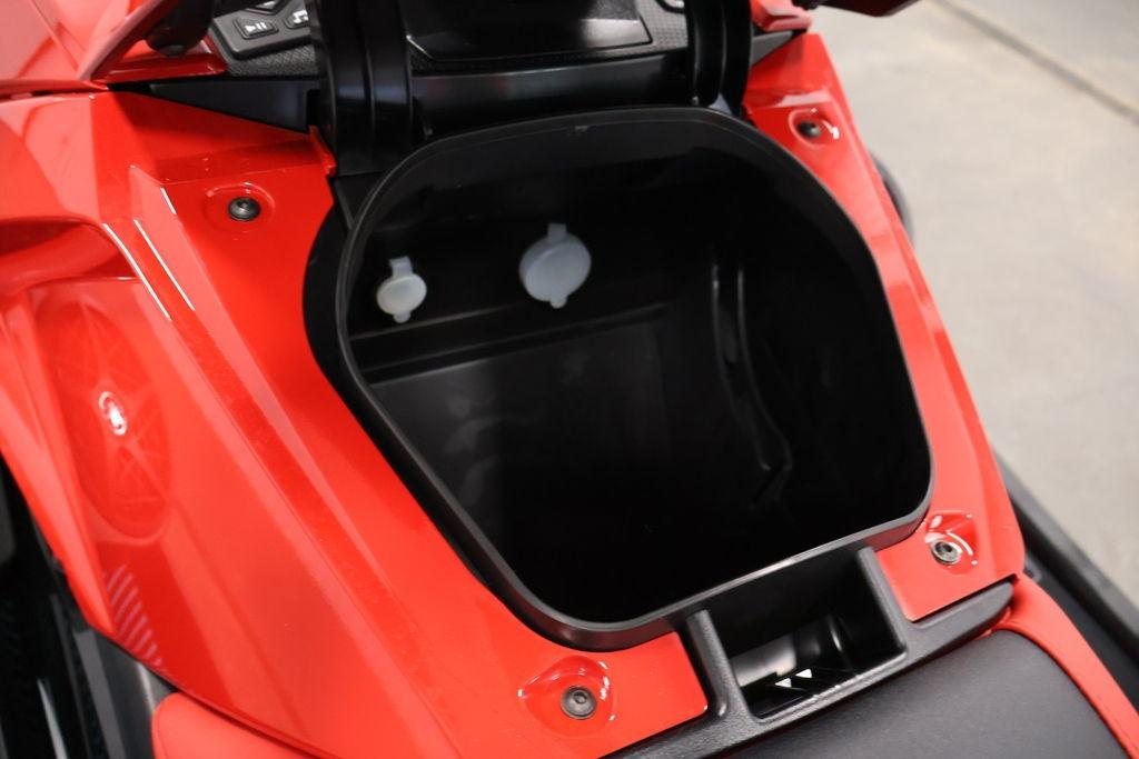 2026 Yamaha WaveRunner VX Deluxe storage compartment, open and empty, in vibrant red color.