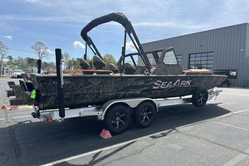 2026 SeaArk EasyCat boat on trailer, parked outside a building.