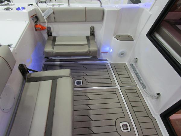 2025 Cutwater C-248 Coupe interior with cushioned seating and modern flooring.