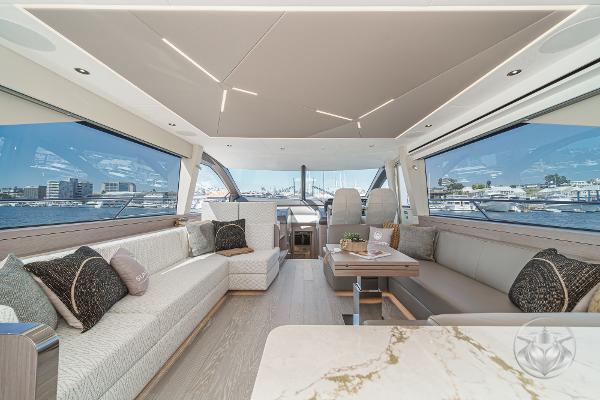 Luxurious interior of 2025 Sunseeker Manhattan 68 yacht with elegant seating and panoramic windows.