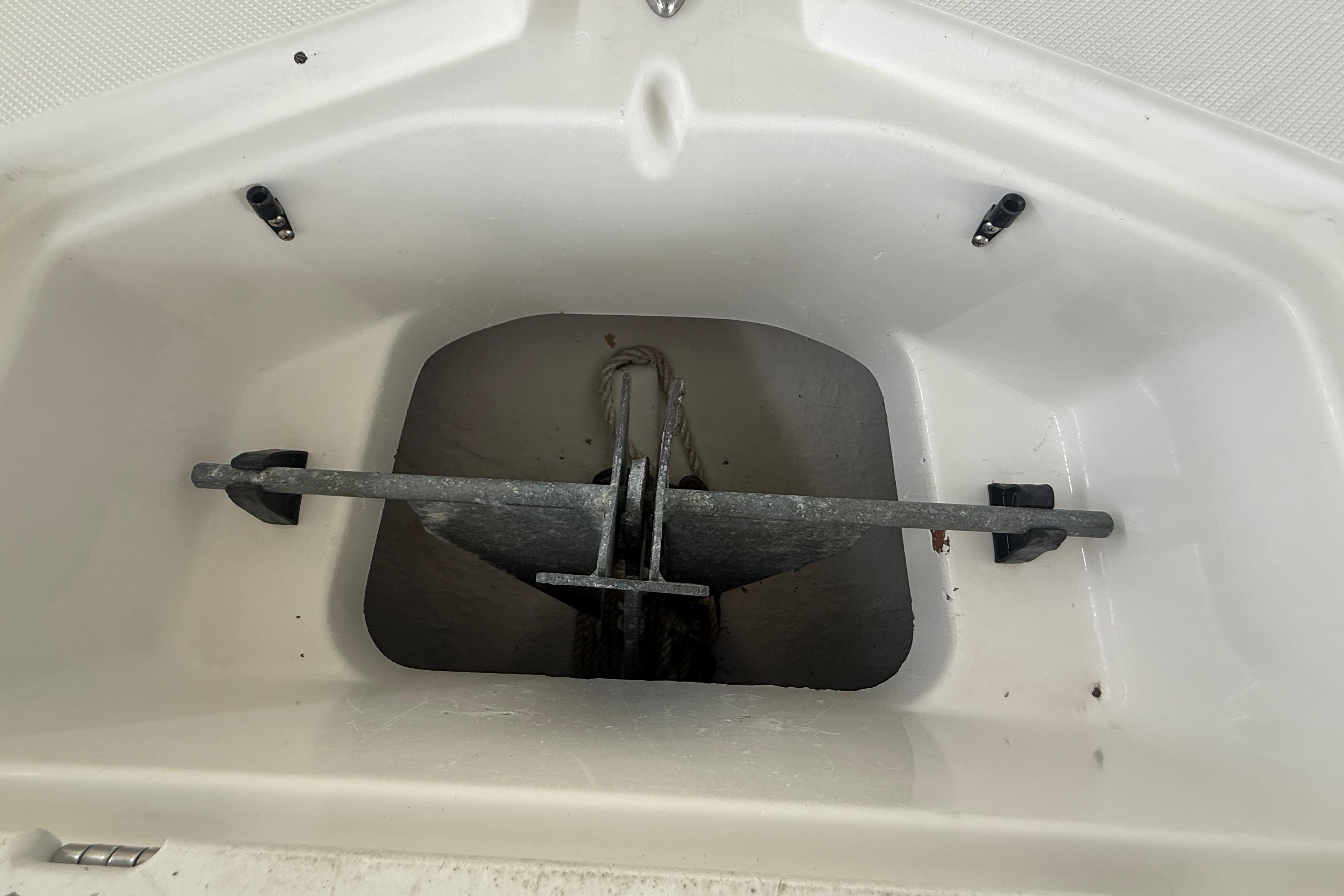 Anchor compartment of 2014 Hurricane SunDeck 2400 OB boat.