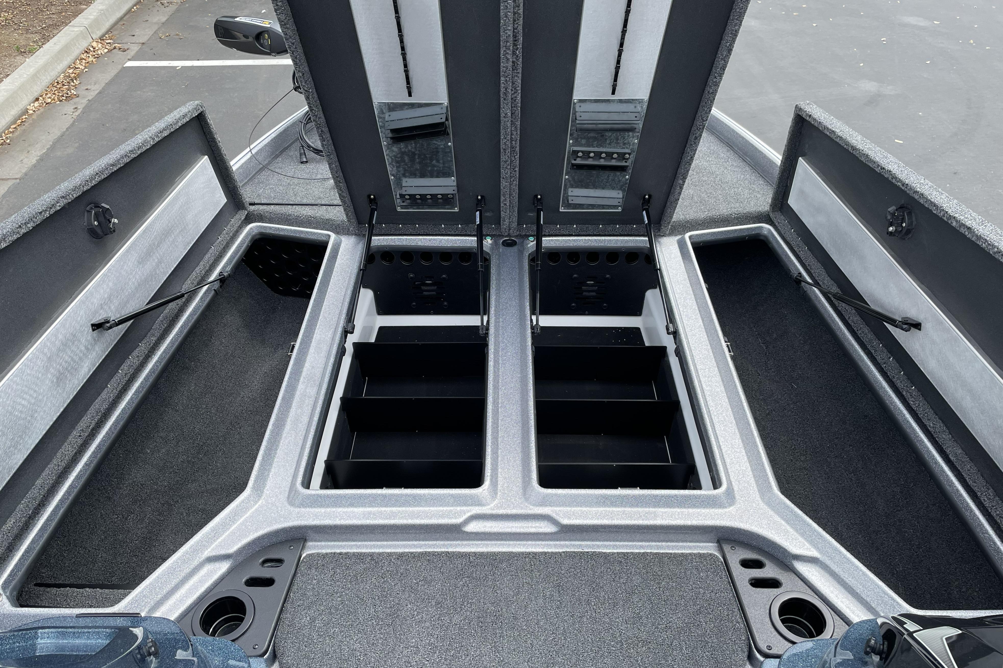 2026 Nitro Z21 XL boat storage compartments with open lids, showcasing organized interior space.