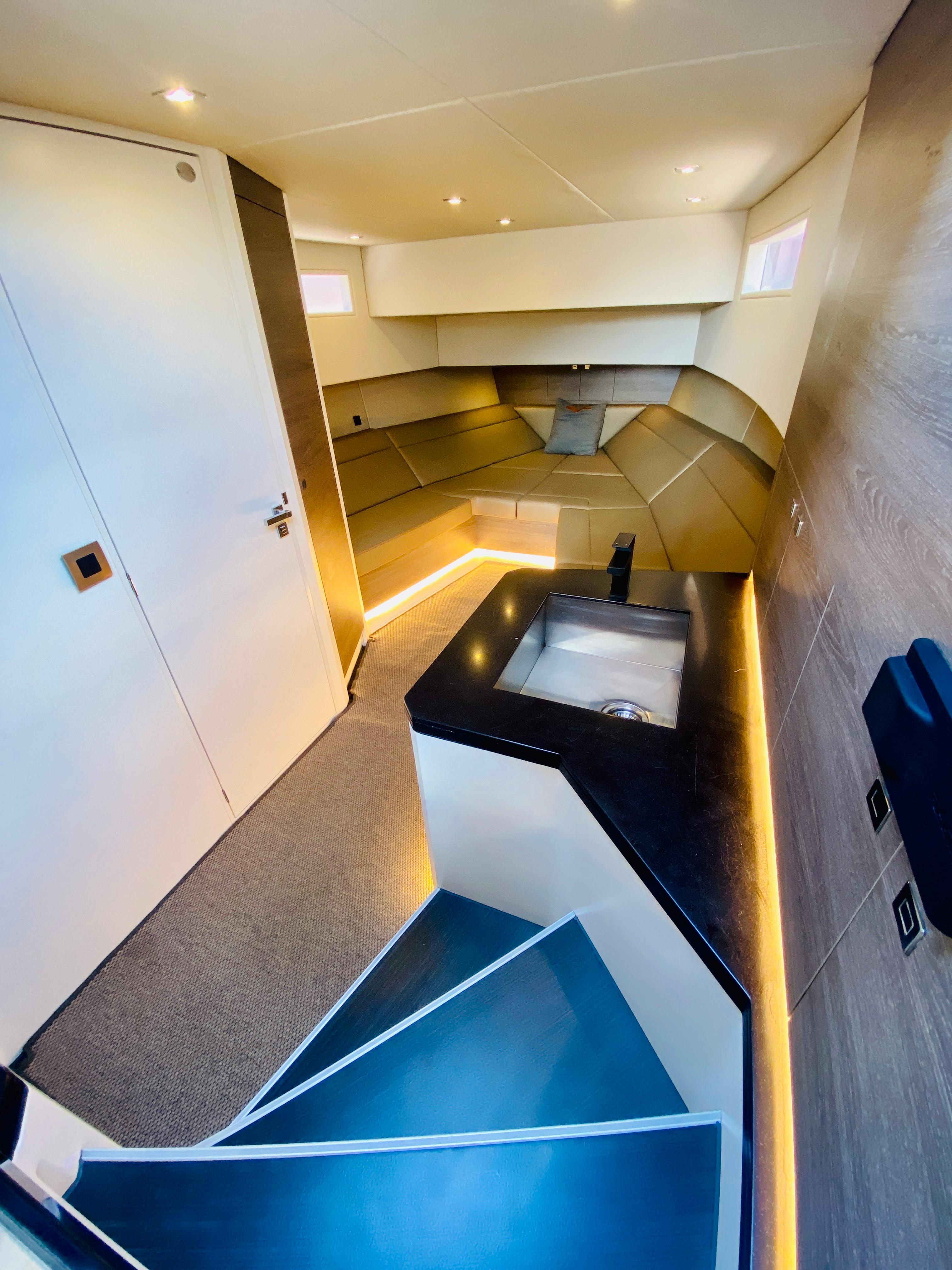 Luxurious interior of 2020 Vanquish VQ45 yacht with modern design and ambient lighting.