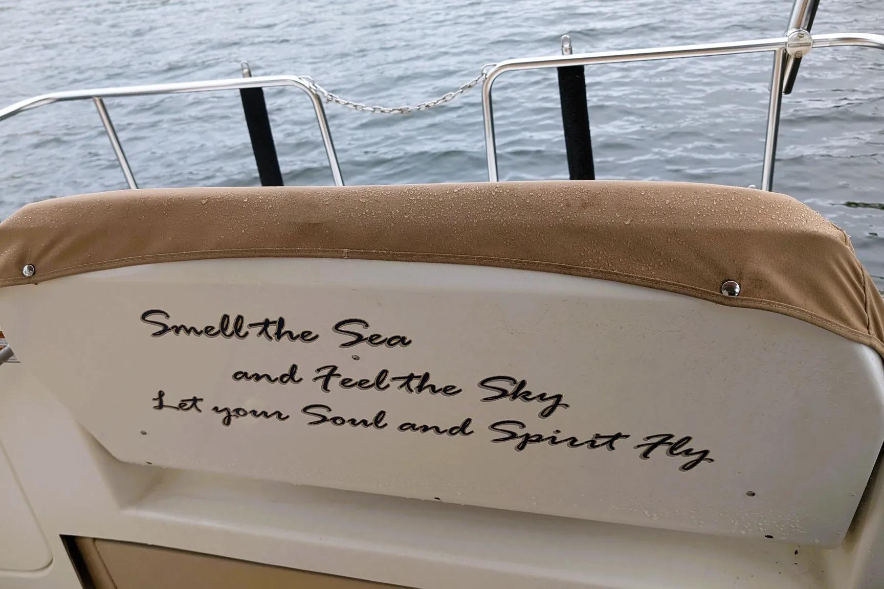 2015 Ranger Tugs R-29 S boat seat with inspirational quote by the water.
