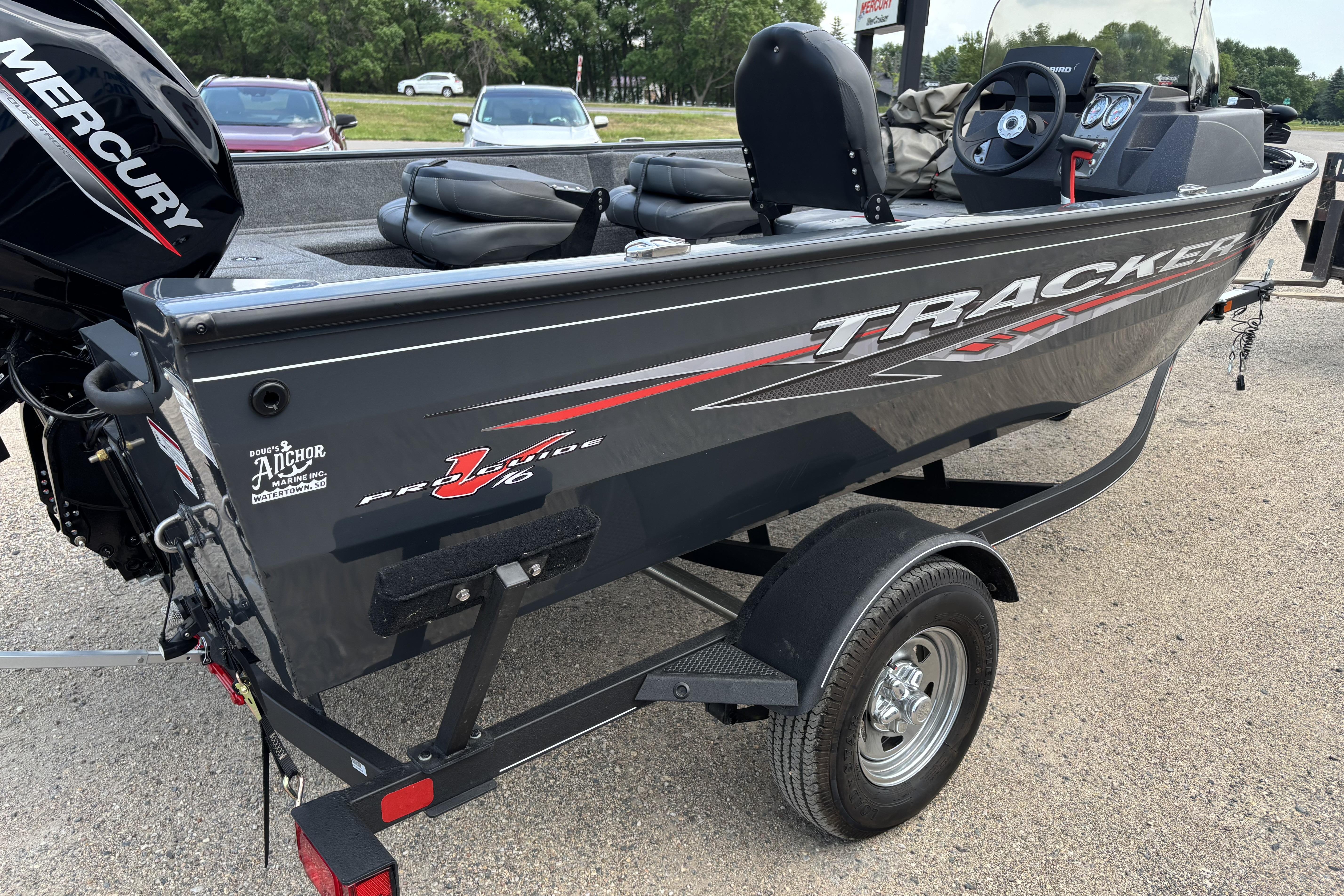 2021 Tracker Pro Guide V-16 WT boat on trailer, featuring Mercury engine.