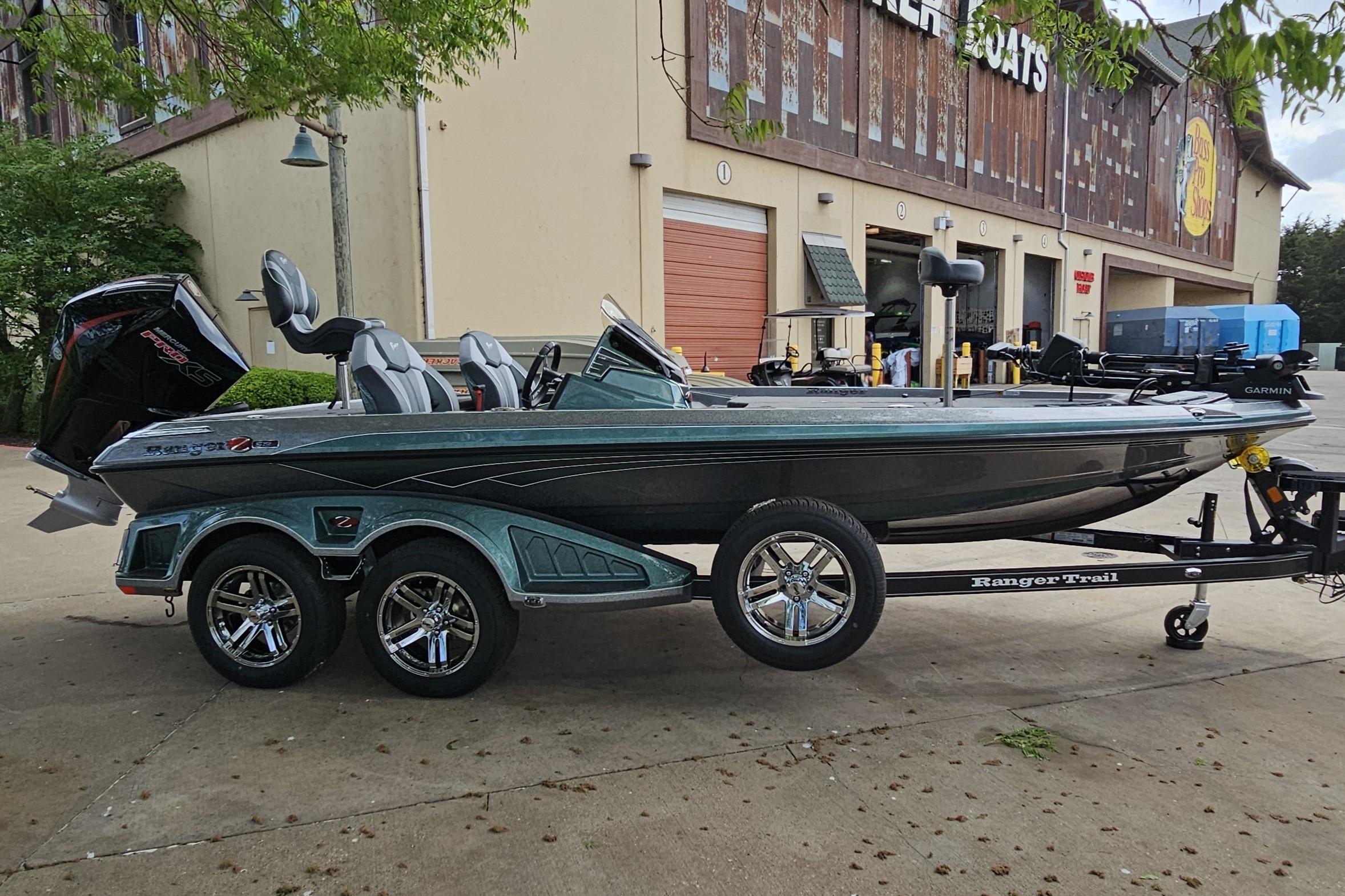 2026 Ranger Z519R Cup-Equipped boat on trailer outside a store.