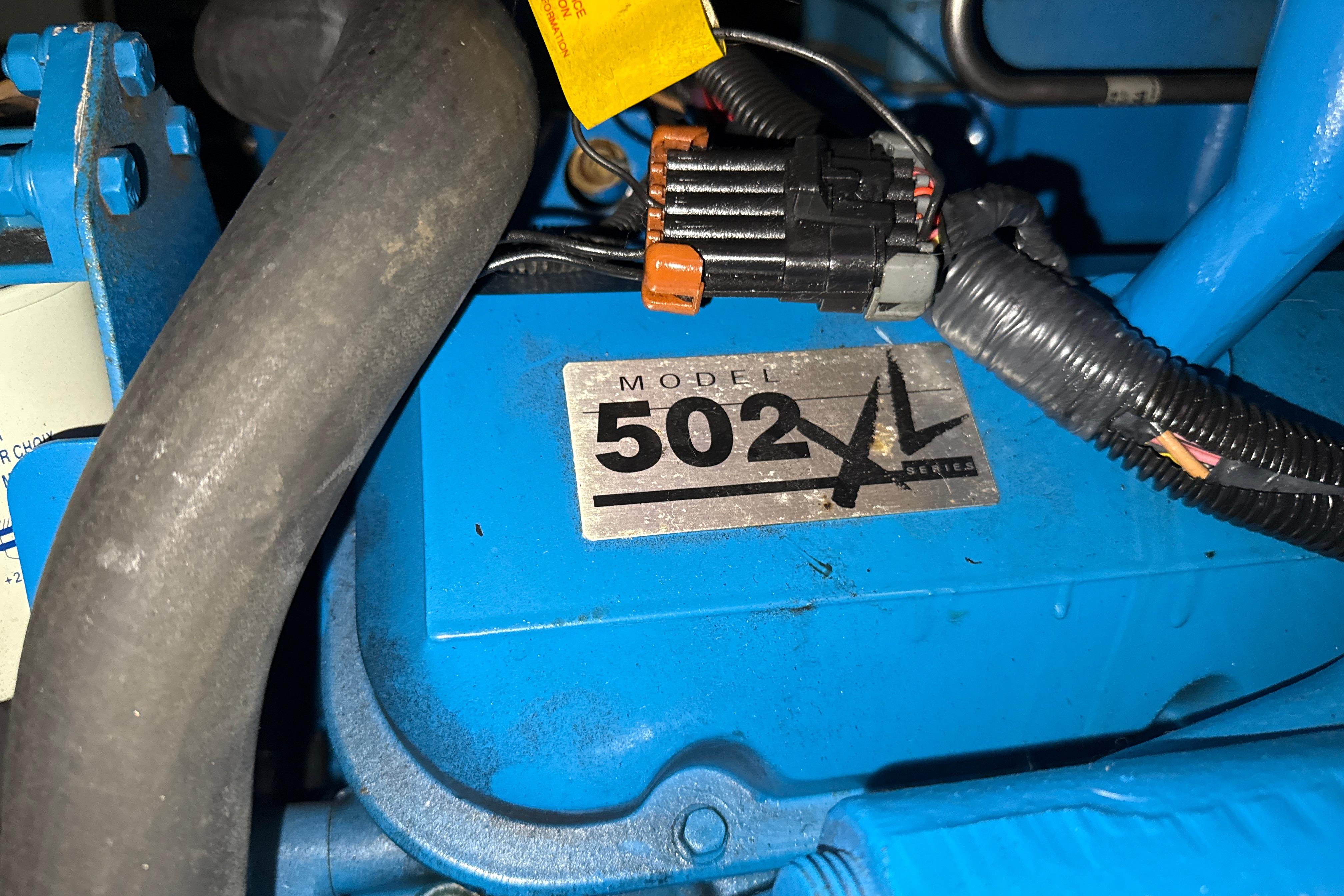 Engine compartment of a 1999 Silverton 422 Motor Yacht, featuring Model 502 XL Series.