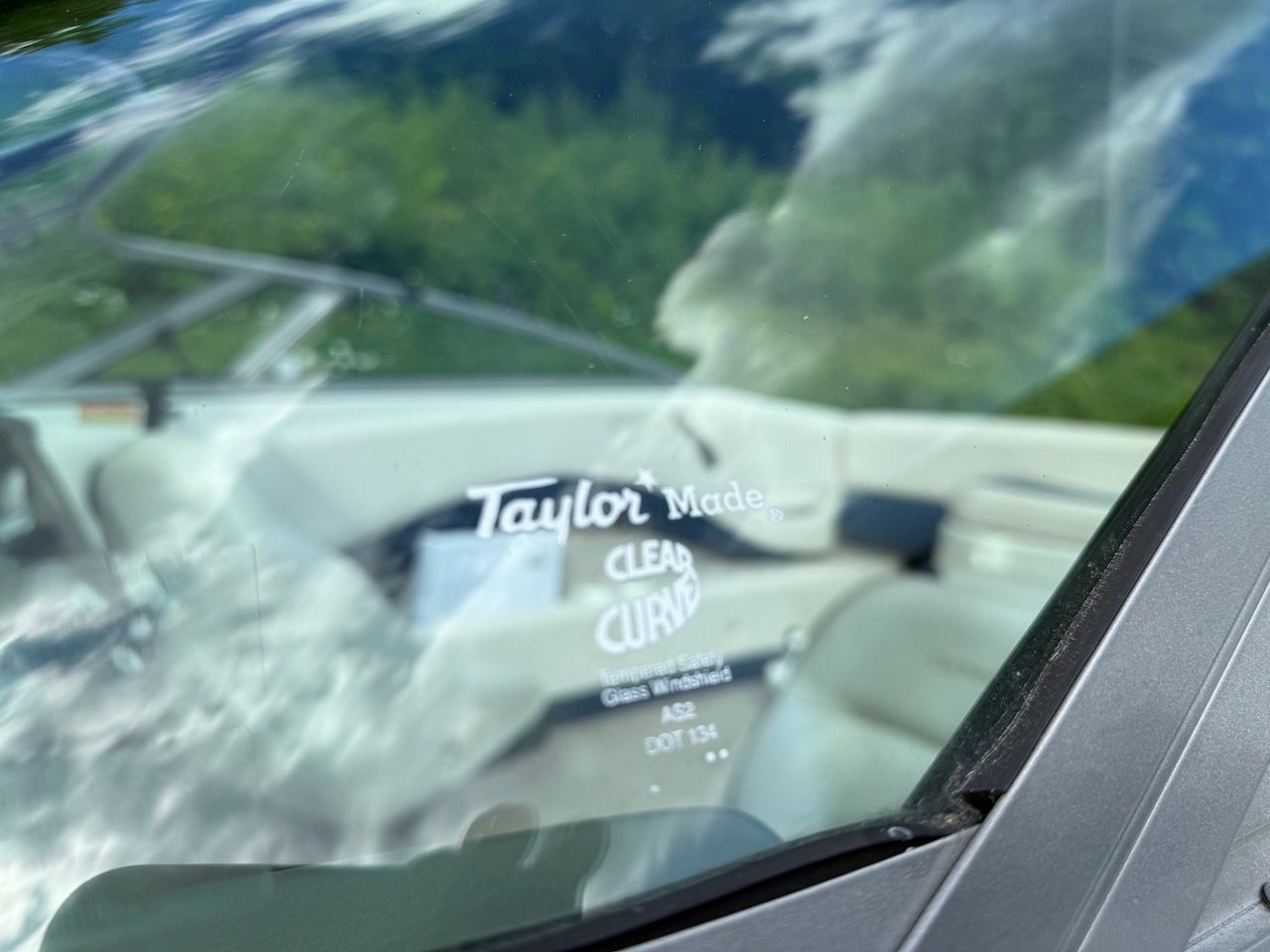 Close-up of a 2000 Crownline 192 BR boat windshield.