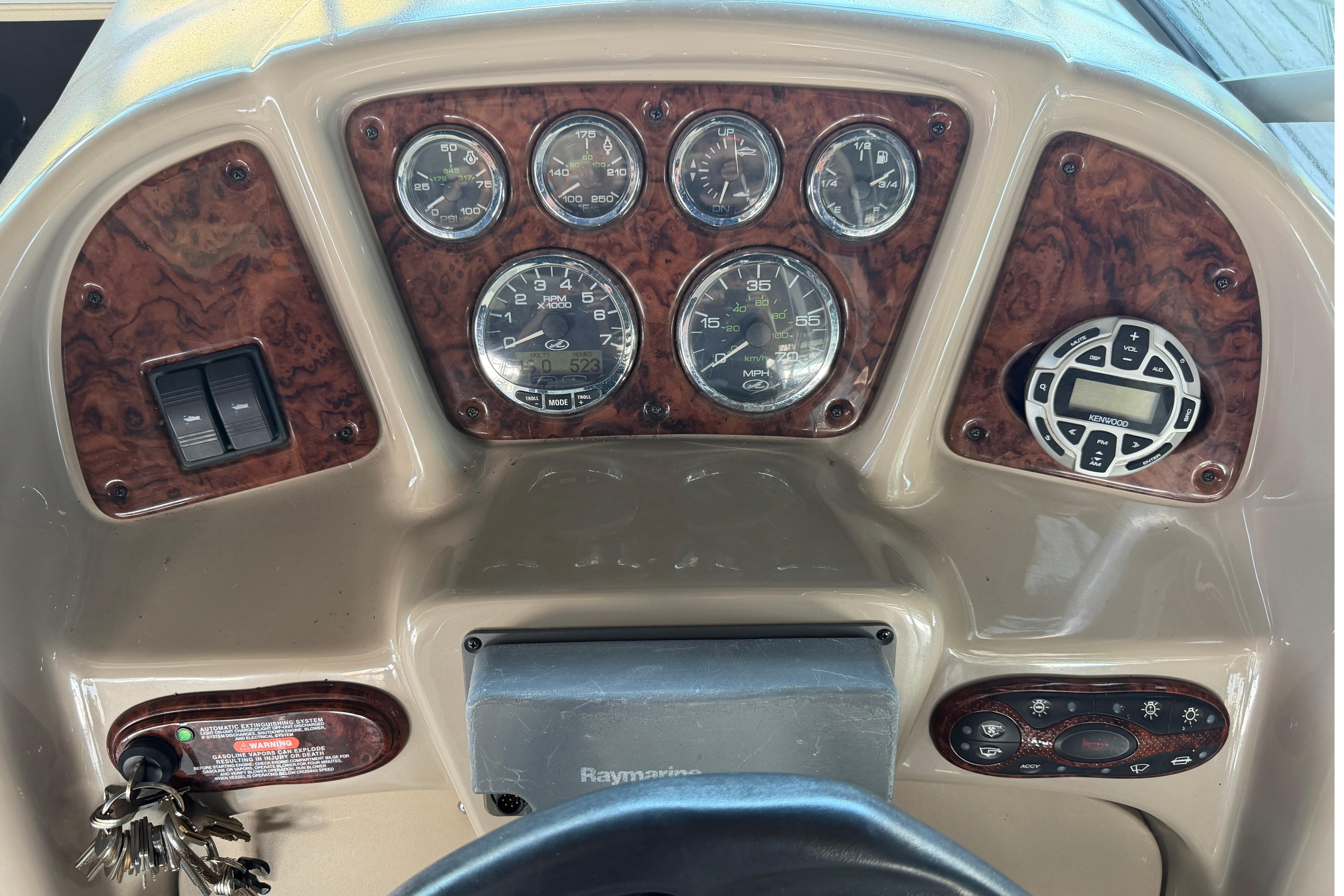 Dashboard of 2004 Sea Ray Sundancer 260 boat with gauges and controls.