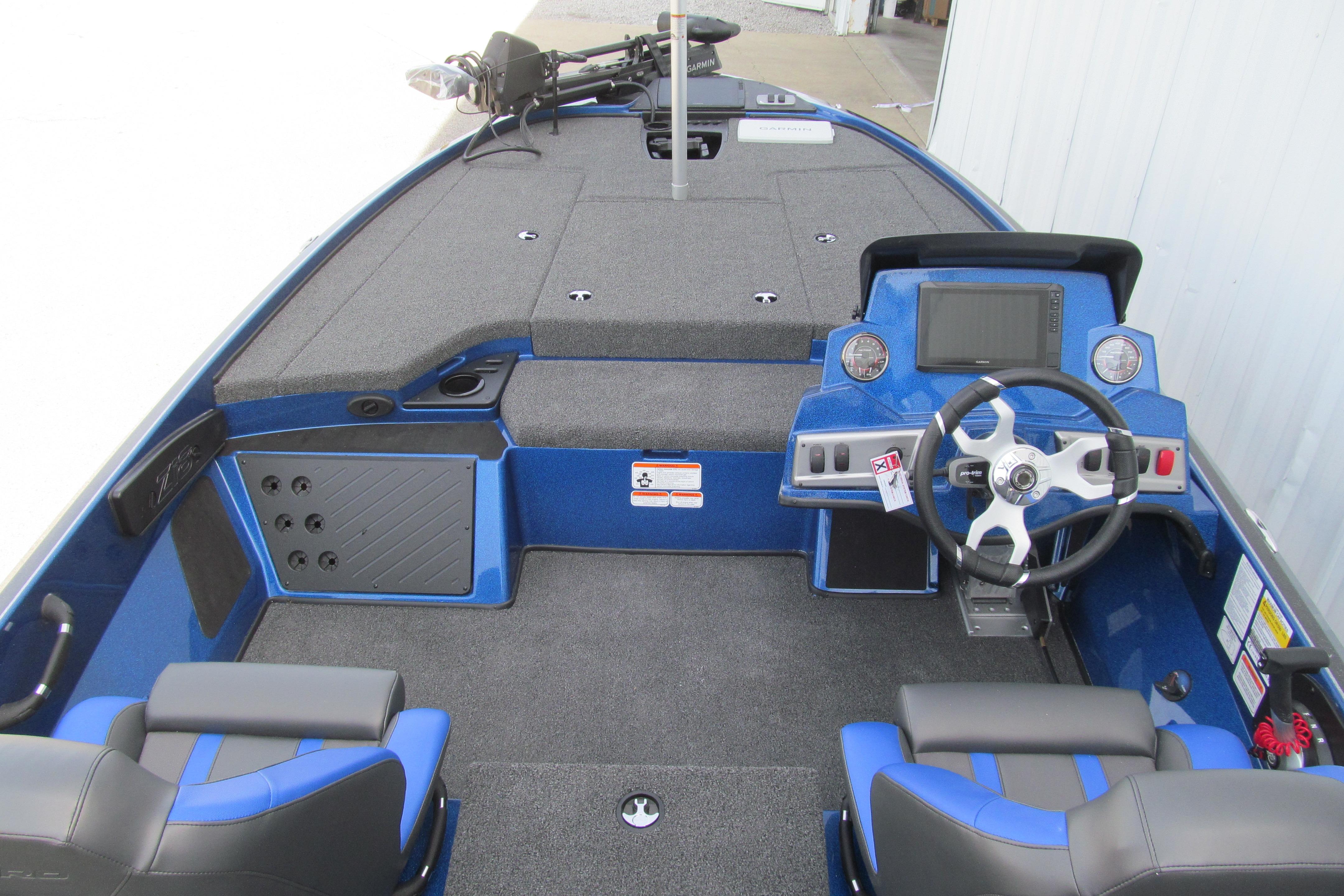 Interior view of a 2026 Nitro Z18 Pro boat, featuring a sleek blue design and modern dashboard.