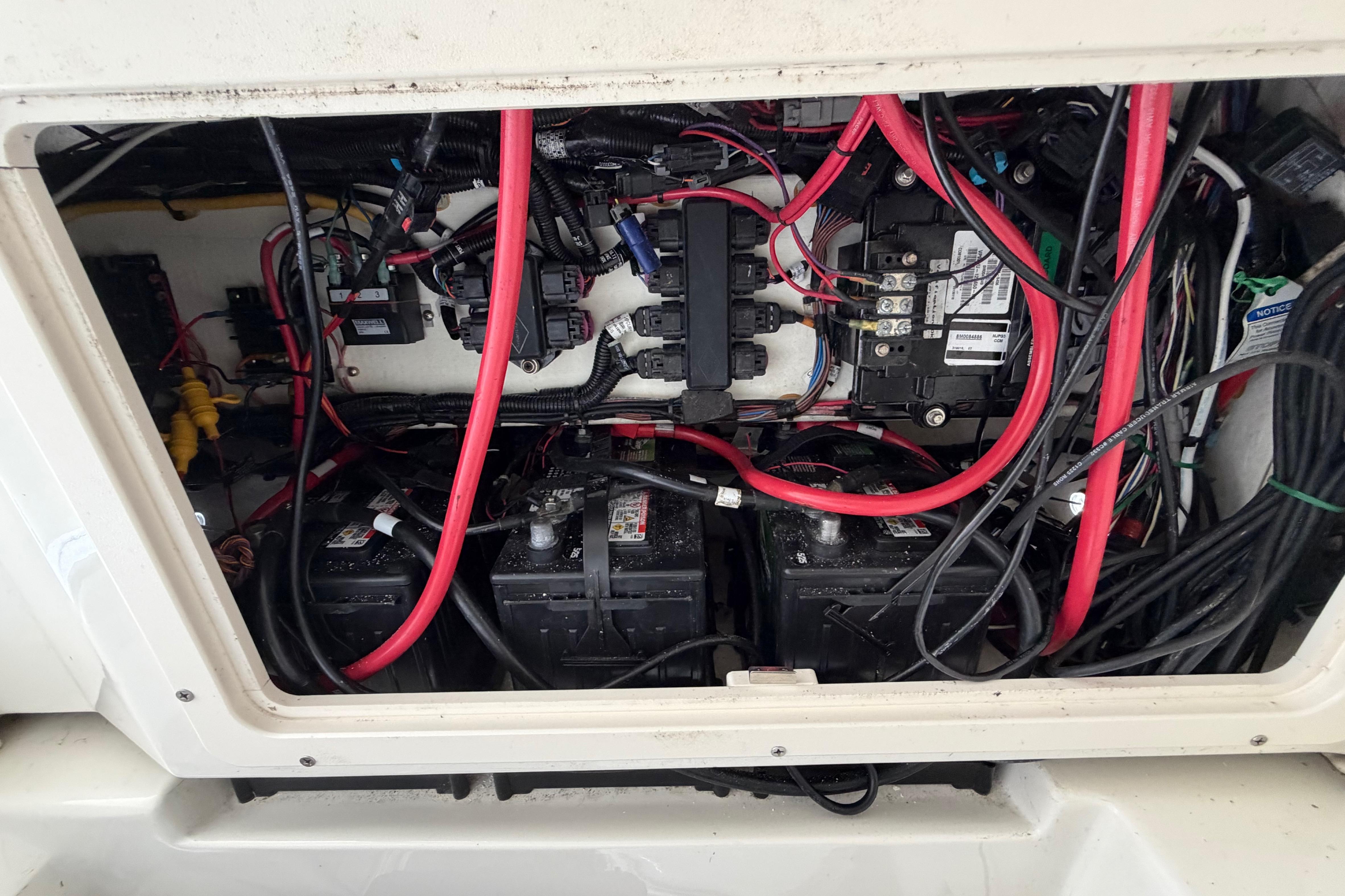 Electrical wiring and battery setup inside a 2017 Mako 284 Center Console boat.