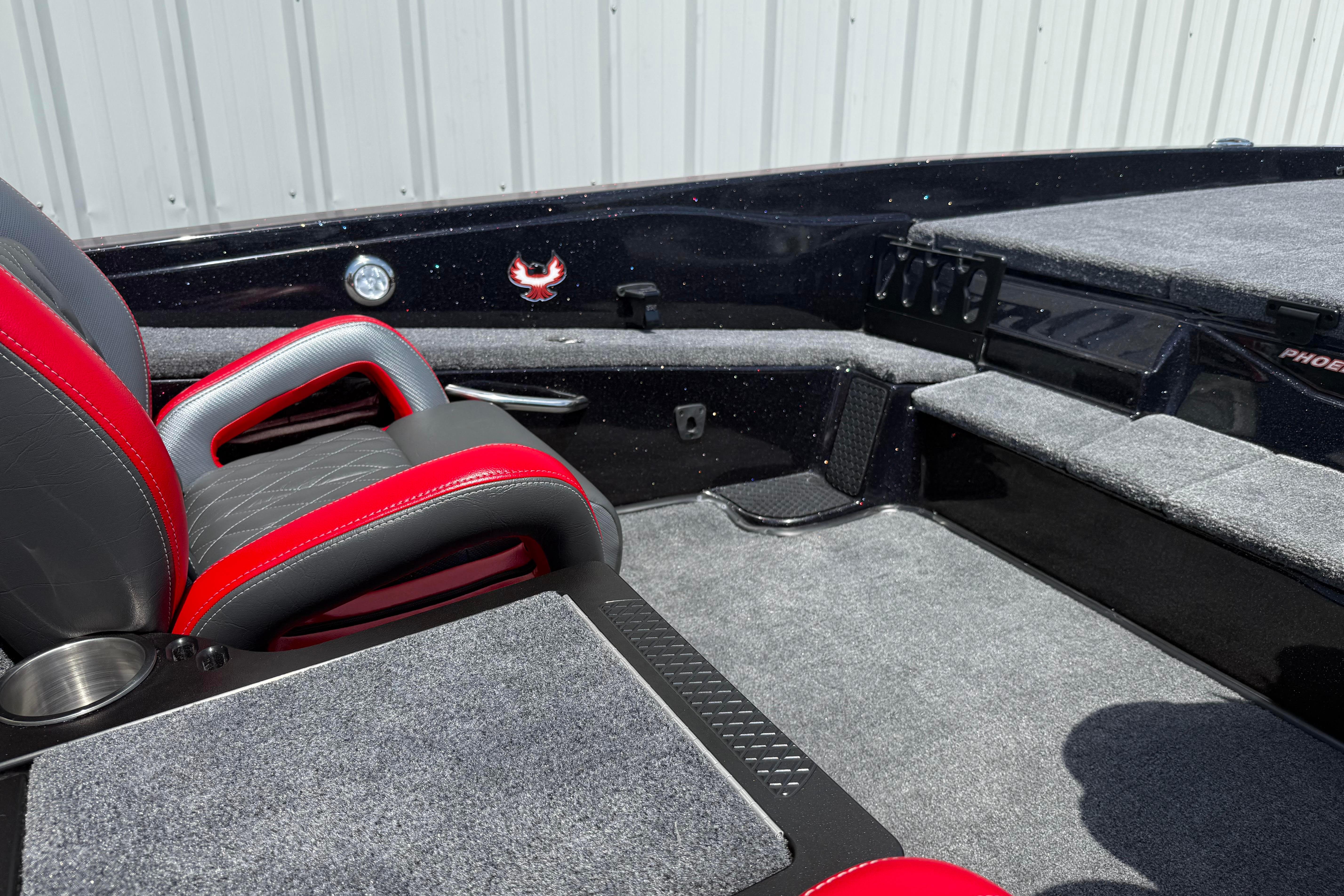 Interior of 2027 Phoenix 919 ZXL boat with red and gray seating.