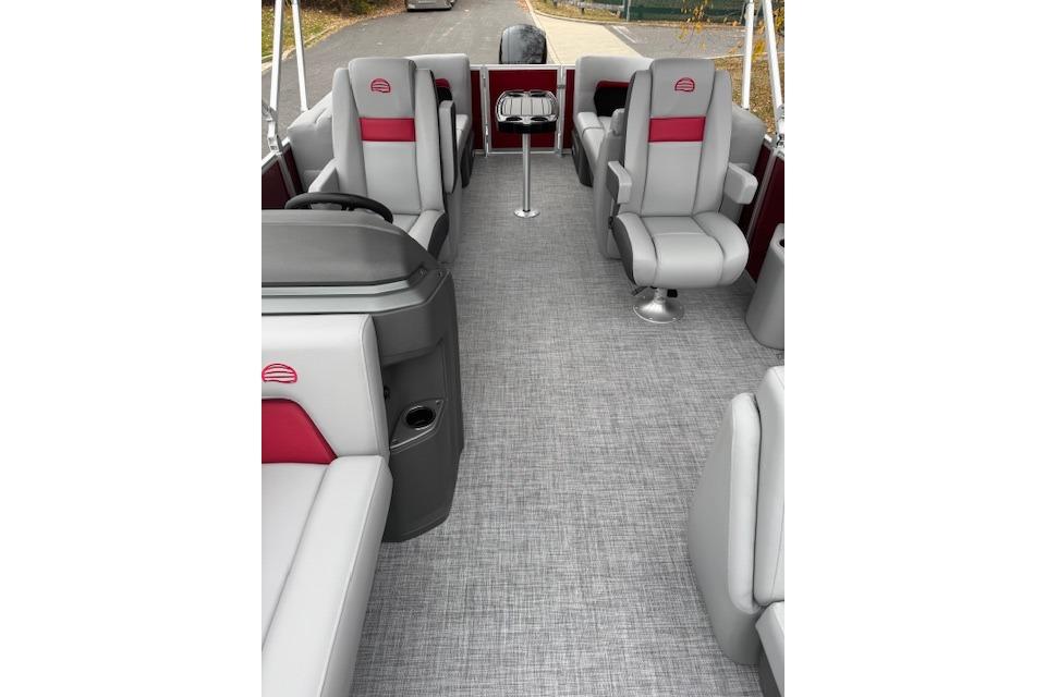 2026 Sun Tracker Party Barge 22 DLX interior with gray and red seating.