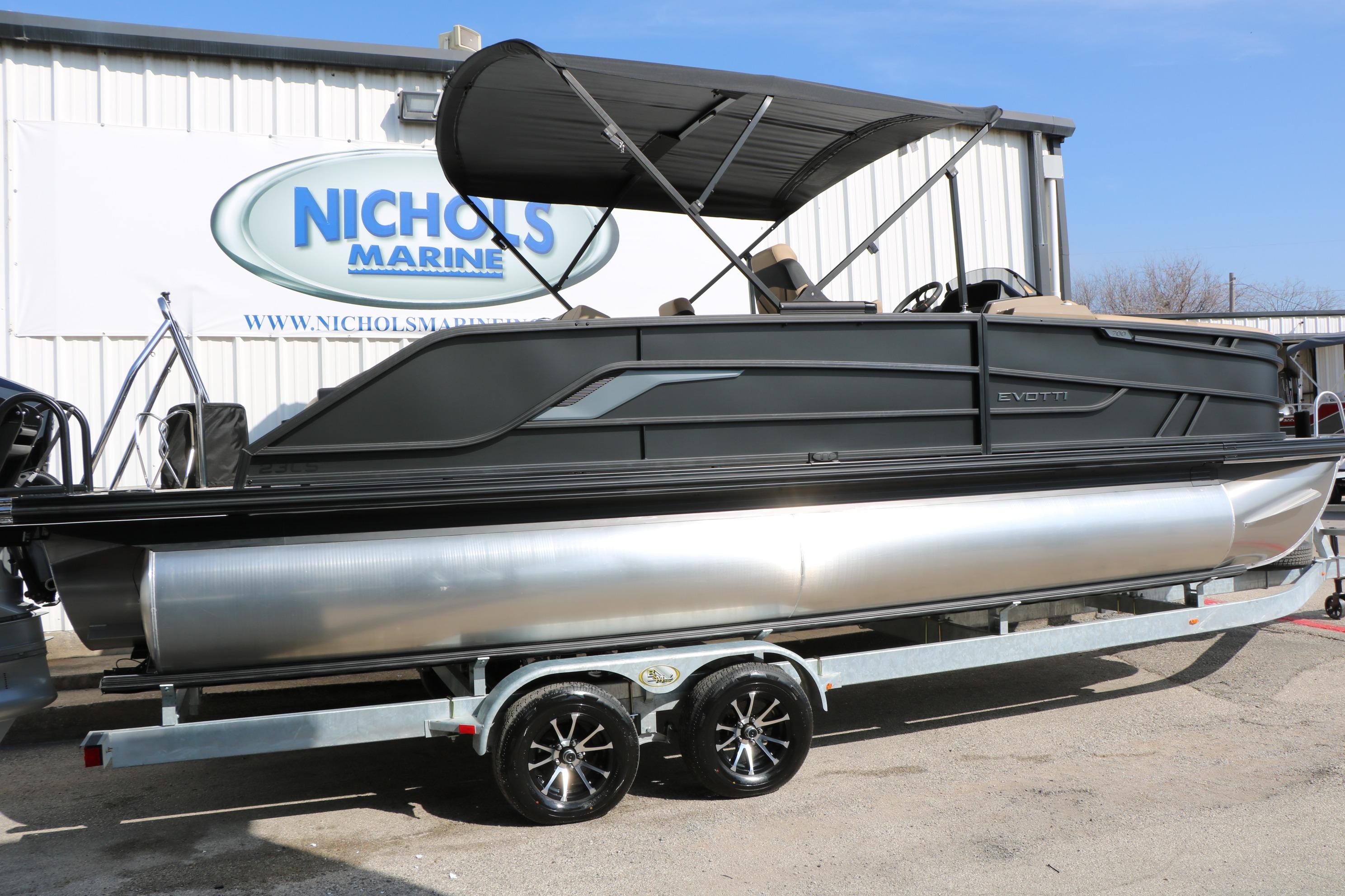2026 Evotti 723CS pontoon boat on trailer at Nichols Marine dealership.