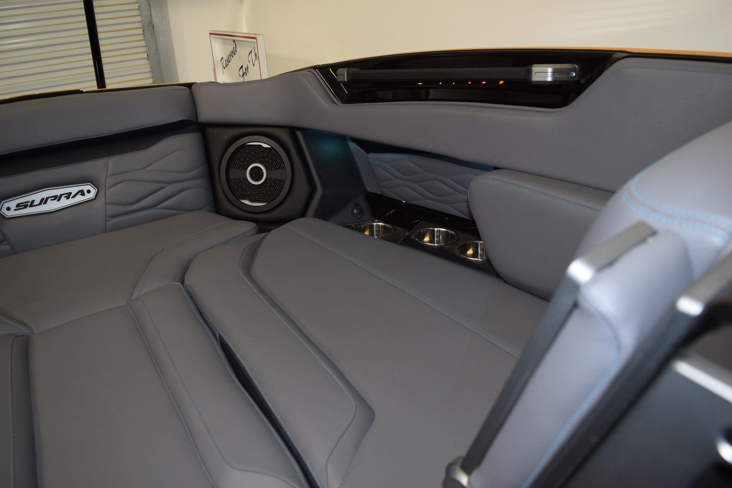 2026 Supra SL 550 interior with premium gray leather seats and integrated speaker system.