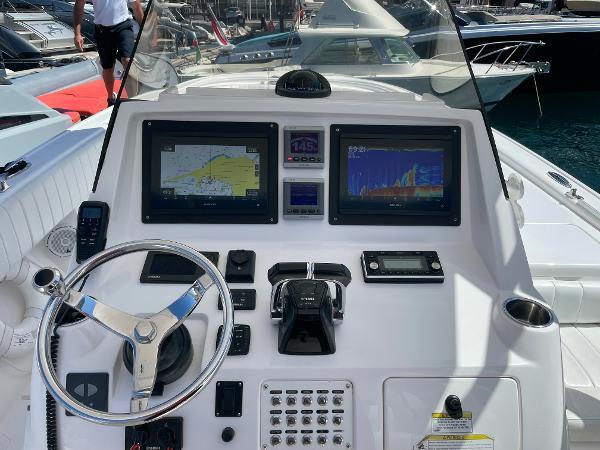 Helm of 2013 Intrepid 327 OPEN boat with navigation screens and controls.