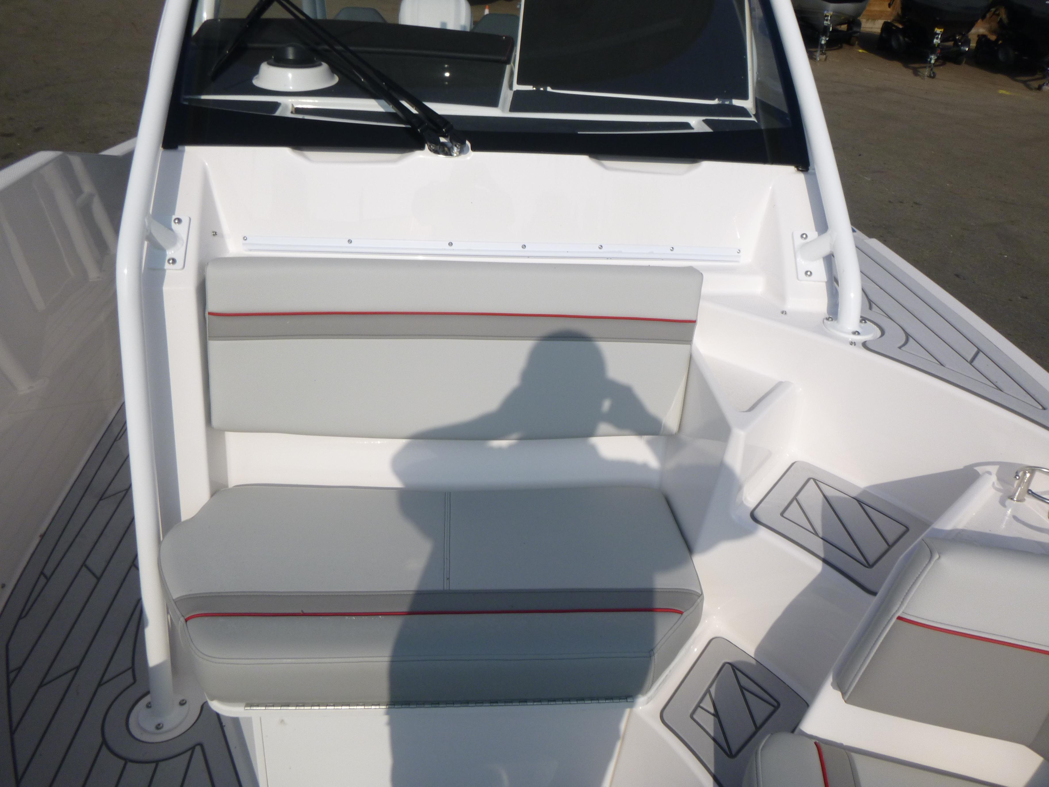 Interior of 2025 Solara S-250 CW boat with gray seating and red accents.