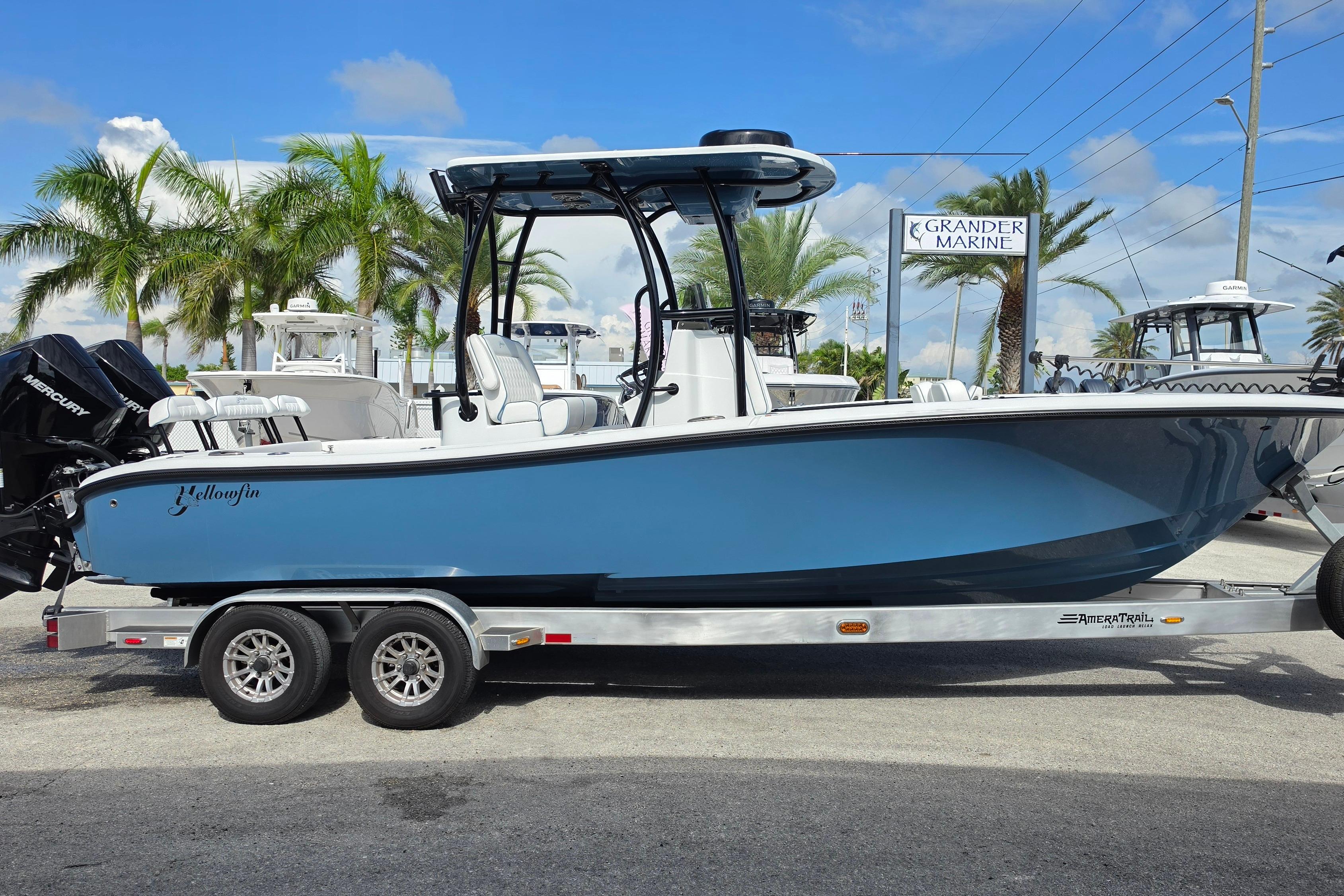 2025 Yellowfin 26 Hybrid boat on trailer at Grander Marine dealership.