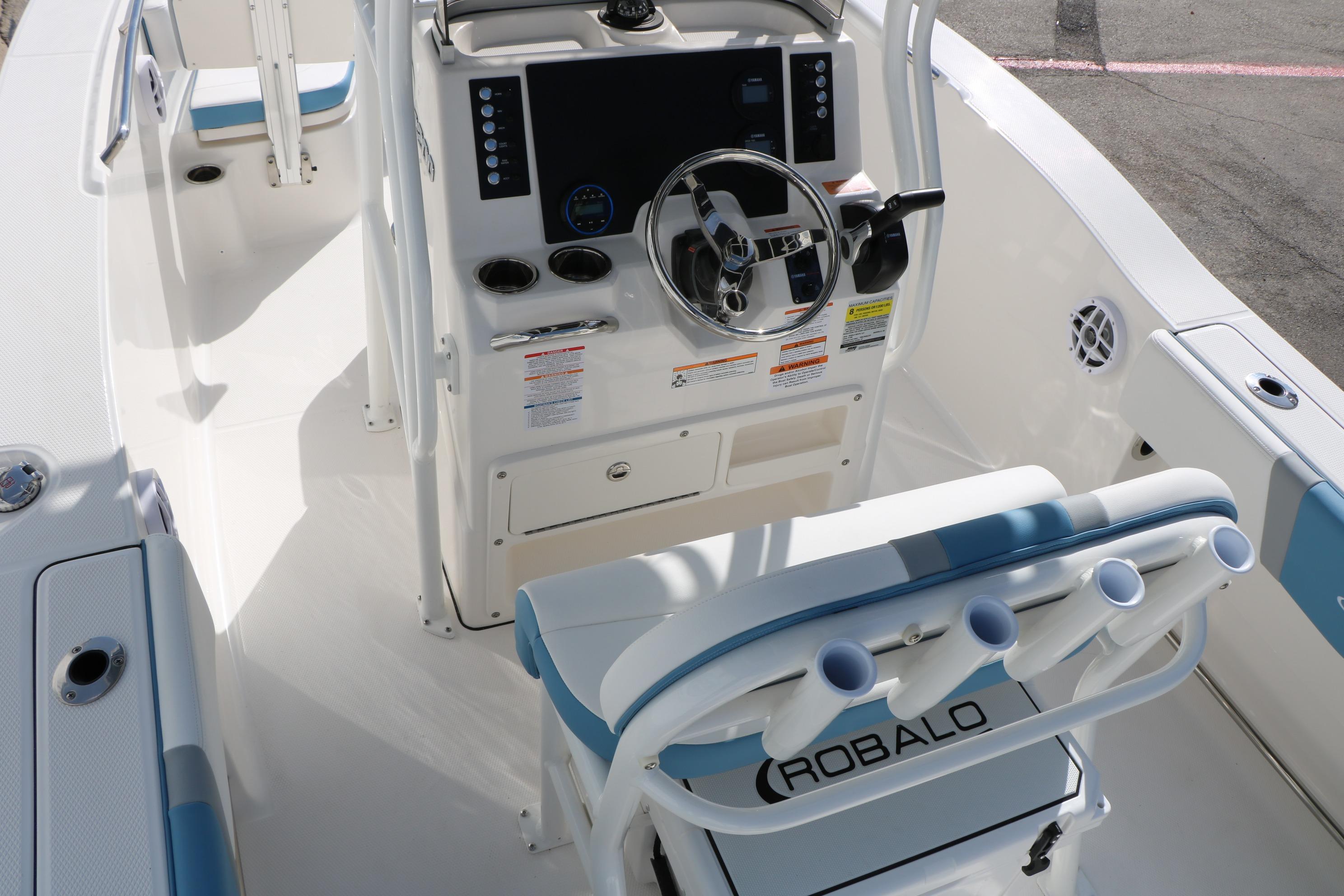 2026 Robalo R200 Center Console boat interior with steering wheel and seating.