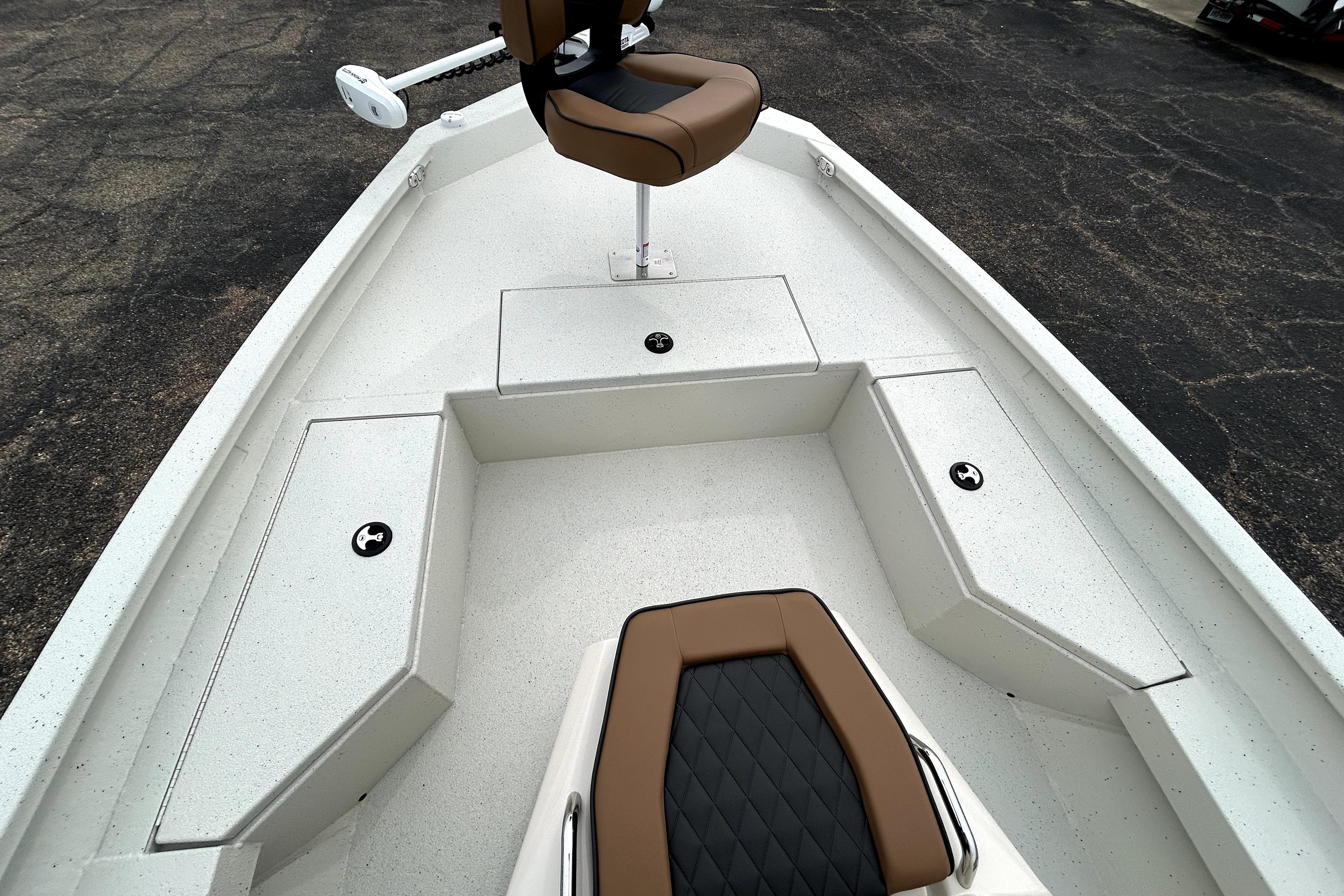 2026 Xpress H20B Bay boat interior with seating and storage compartments.