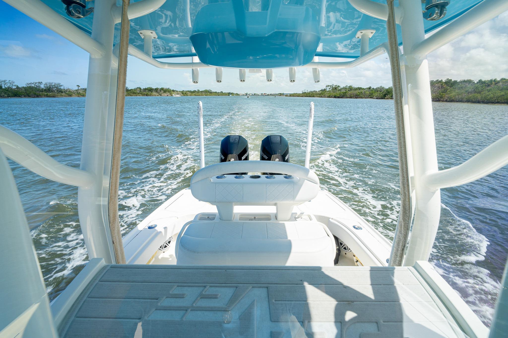 2018 SeaVee 270Z boat cruising on a scenic waterway, showcasing dual engines and sleek design.