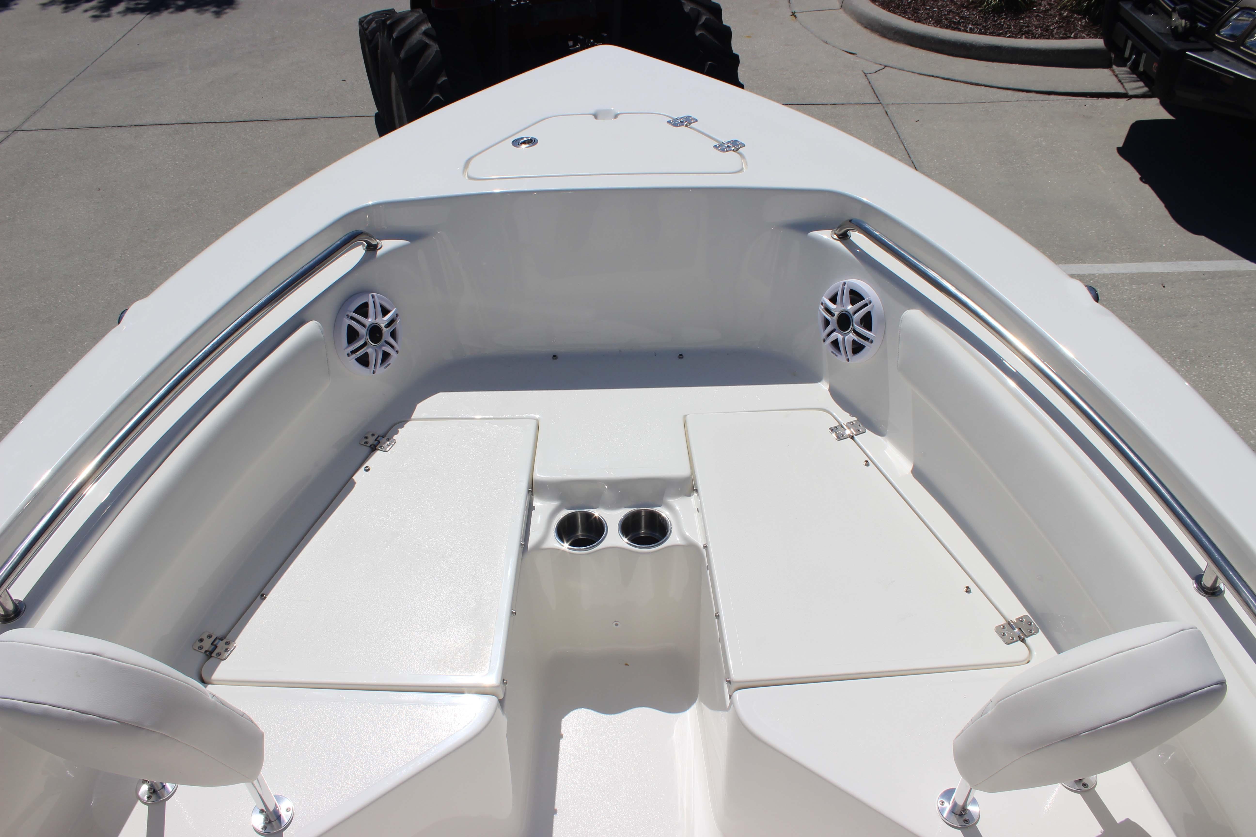 2026 Key West 203 FS boat interior with seating and cup holders.
