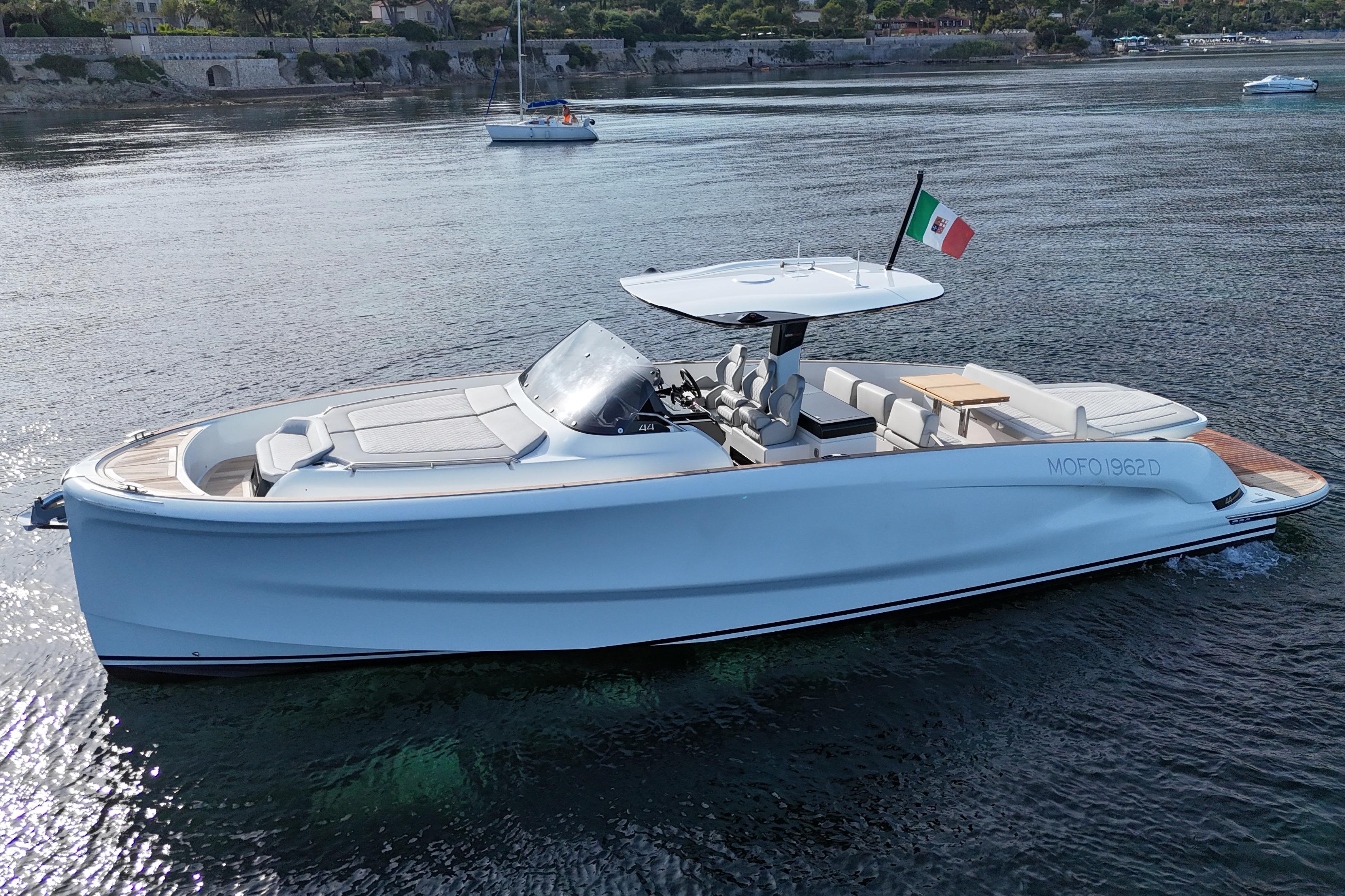 2024 Solaris 44 yacht on calm water, featuring sleek design and Italian flag.