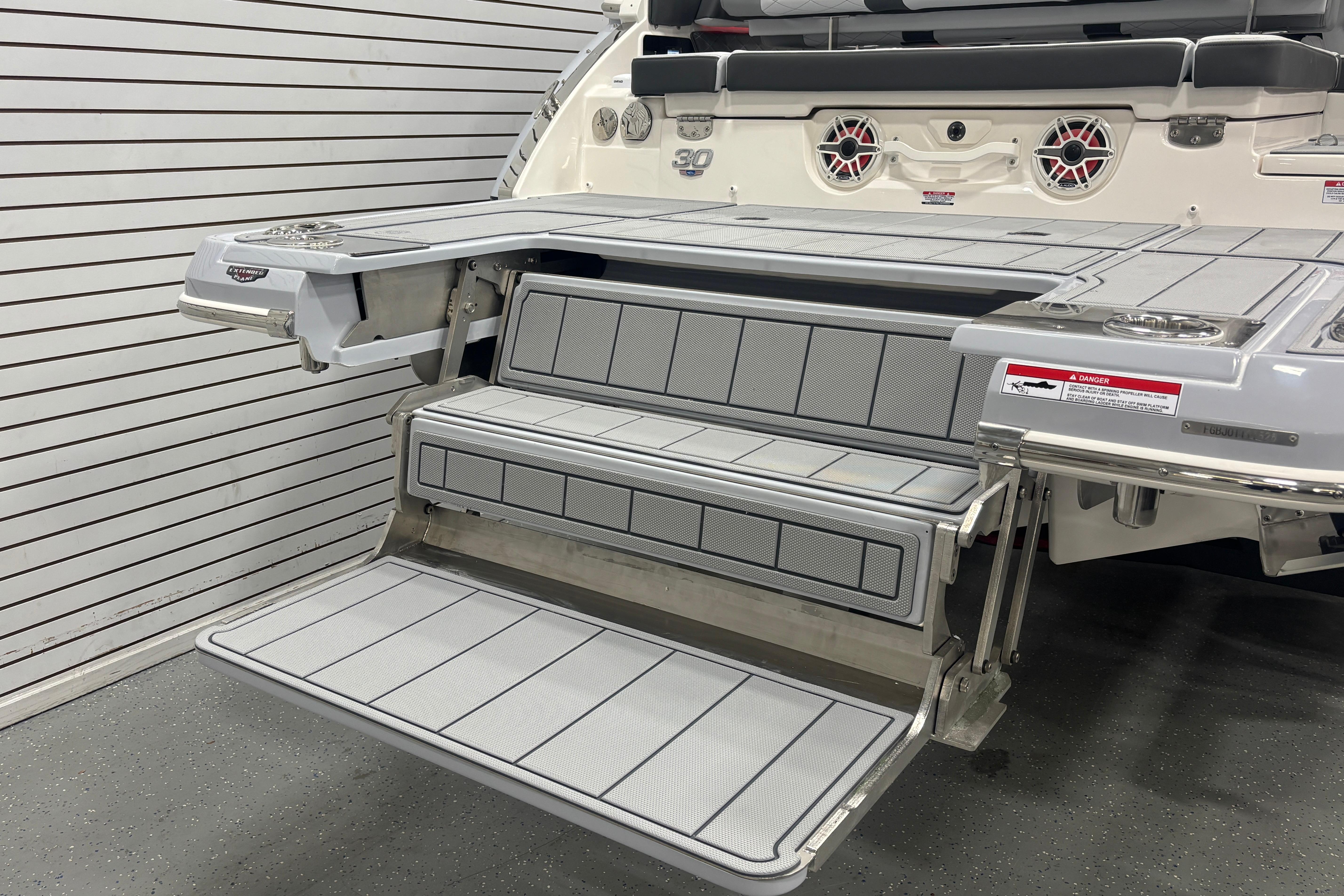 2026 Chaparral SSX 30 boat swim platform with foldable steps and sleek design.