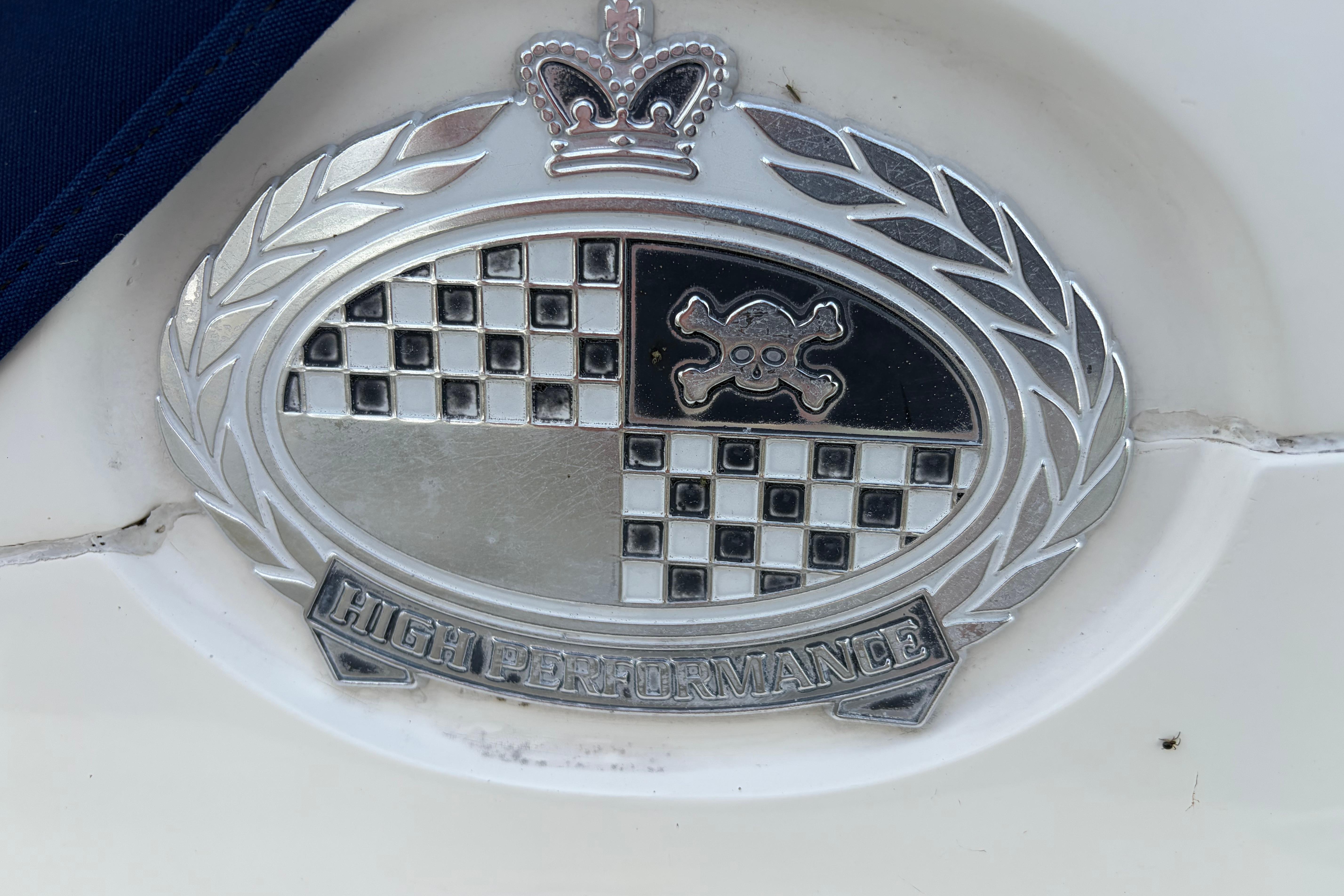 Emblem on 2000 Sunseeker Superhawk 34, featuring "High Performance" text and crown design.