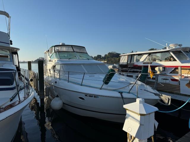 2000 Cruisers Yachts 4450 Express Motor Yacht docked at marina.