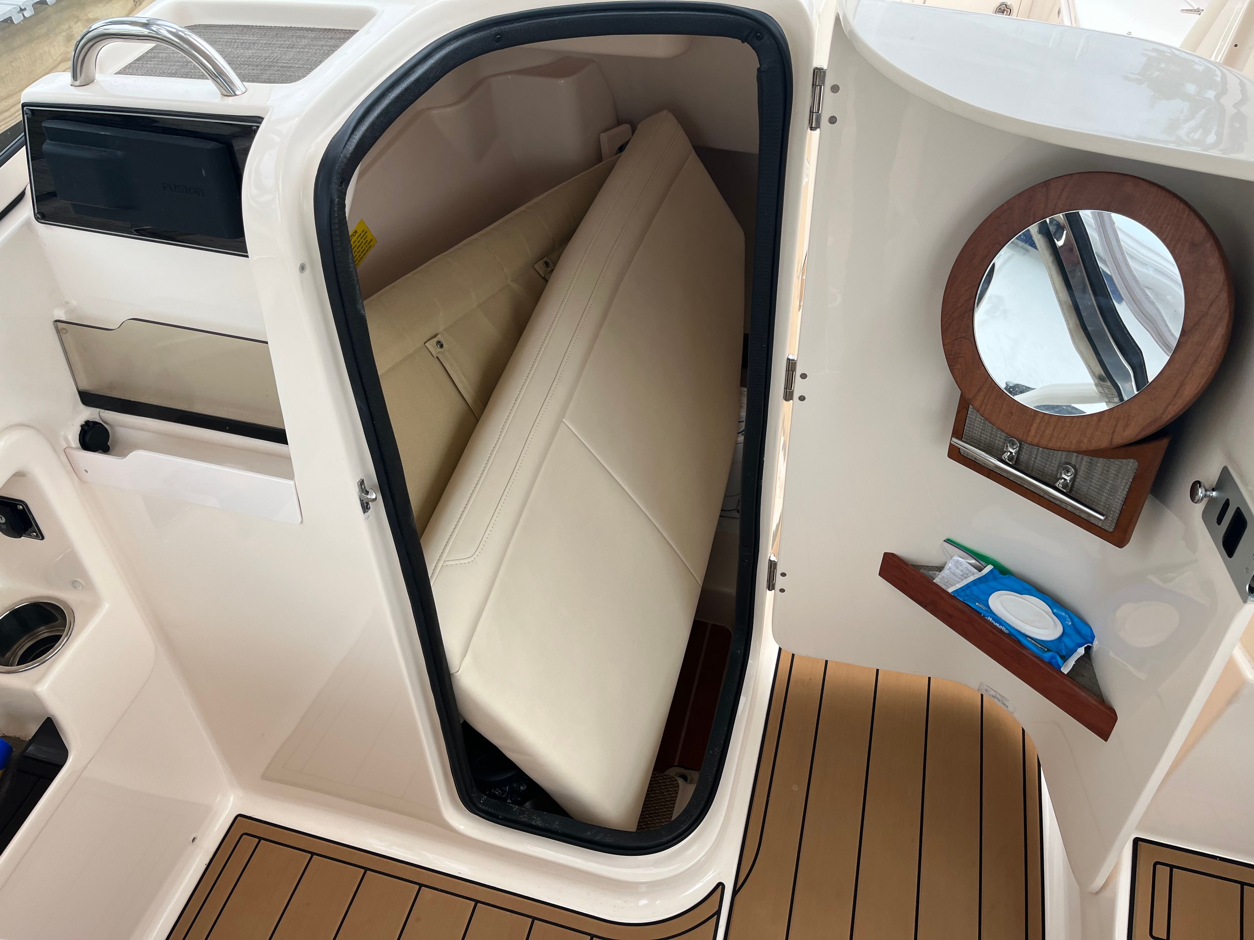 Interior of 2022 Grady-White Freedom 275 with mirror and storage.