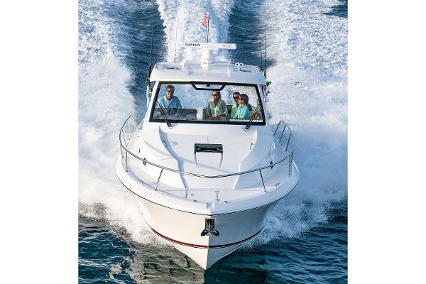 Manufacturer Provided Image: 2019 Pursuit OS 355 Offshore boat cruising with passengers.