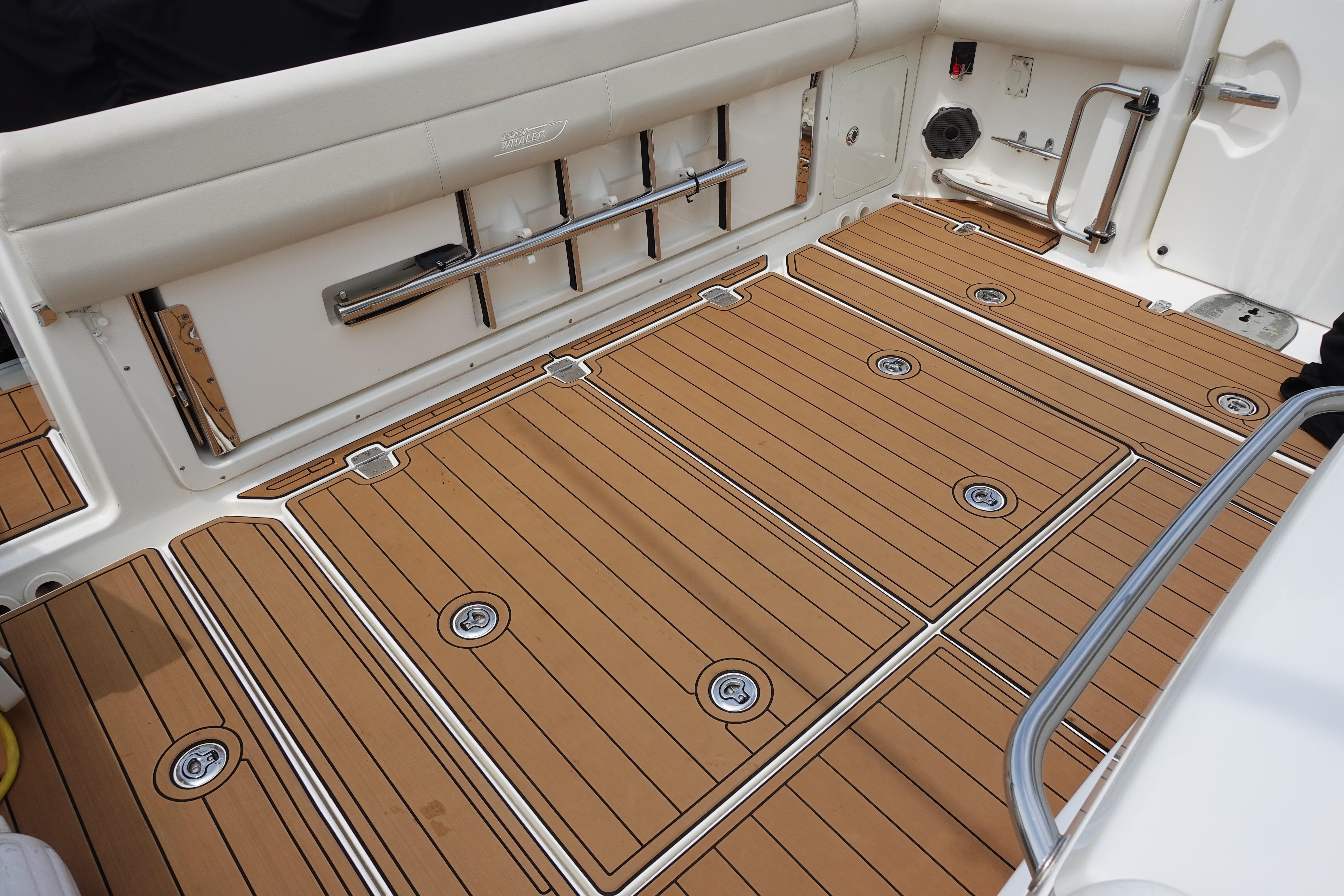 2020 Boston Whaler 420 Outrage deck with teak flooring and stainless steel accents.