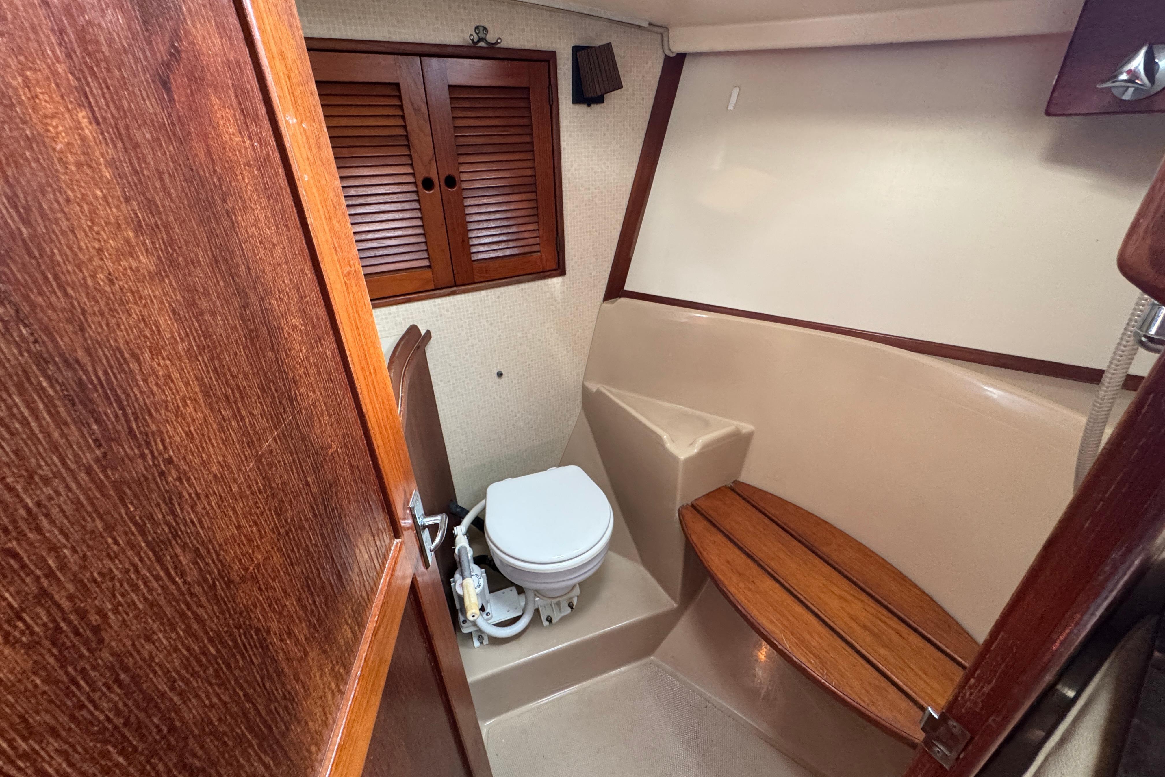 1991 Island Packet Yachts 38 bathroom with wooden accents and compact design.